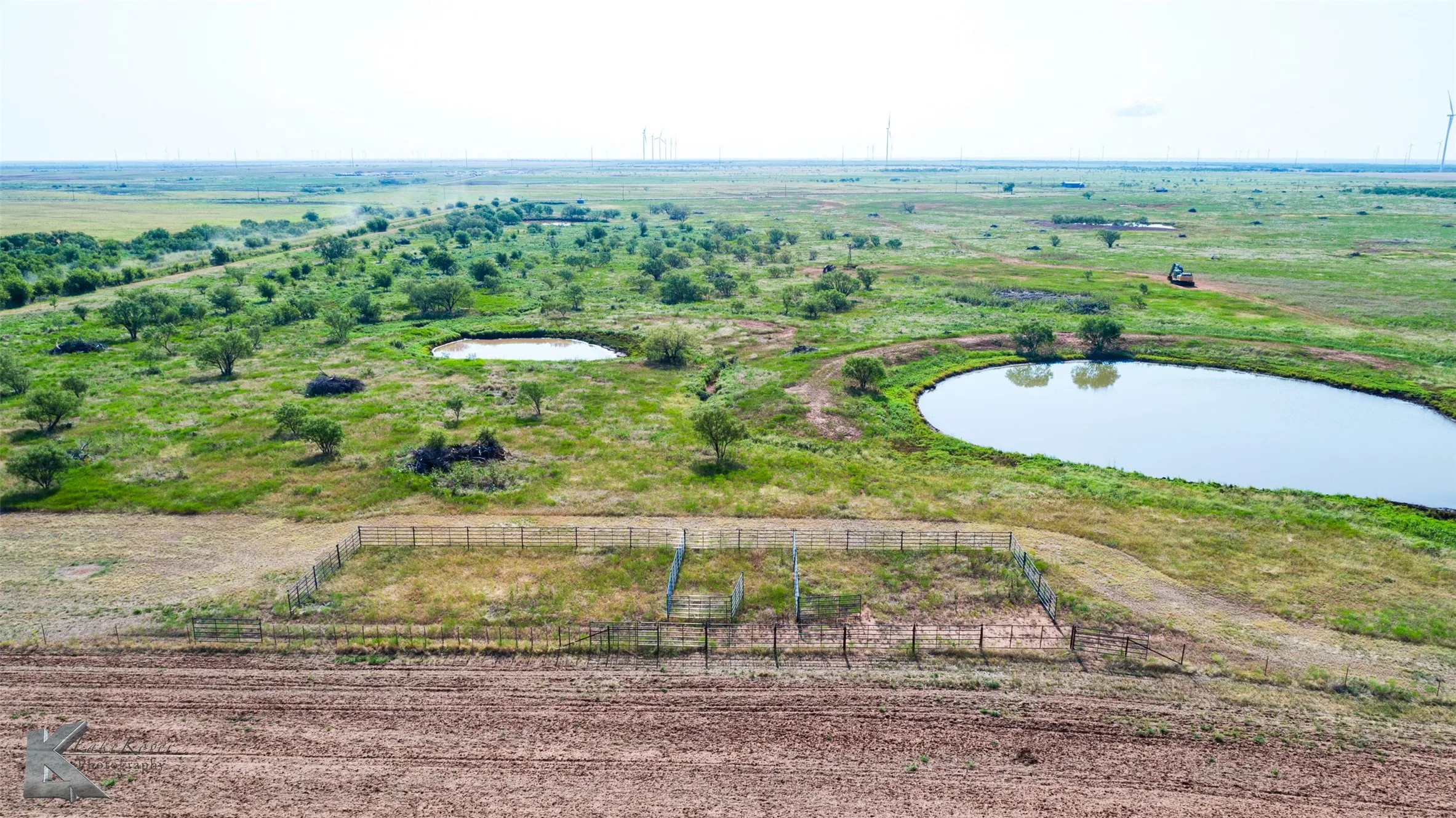 Overview of rural landscape featuring a nearby body of water
