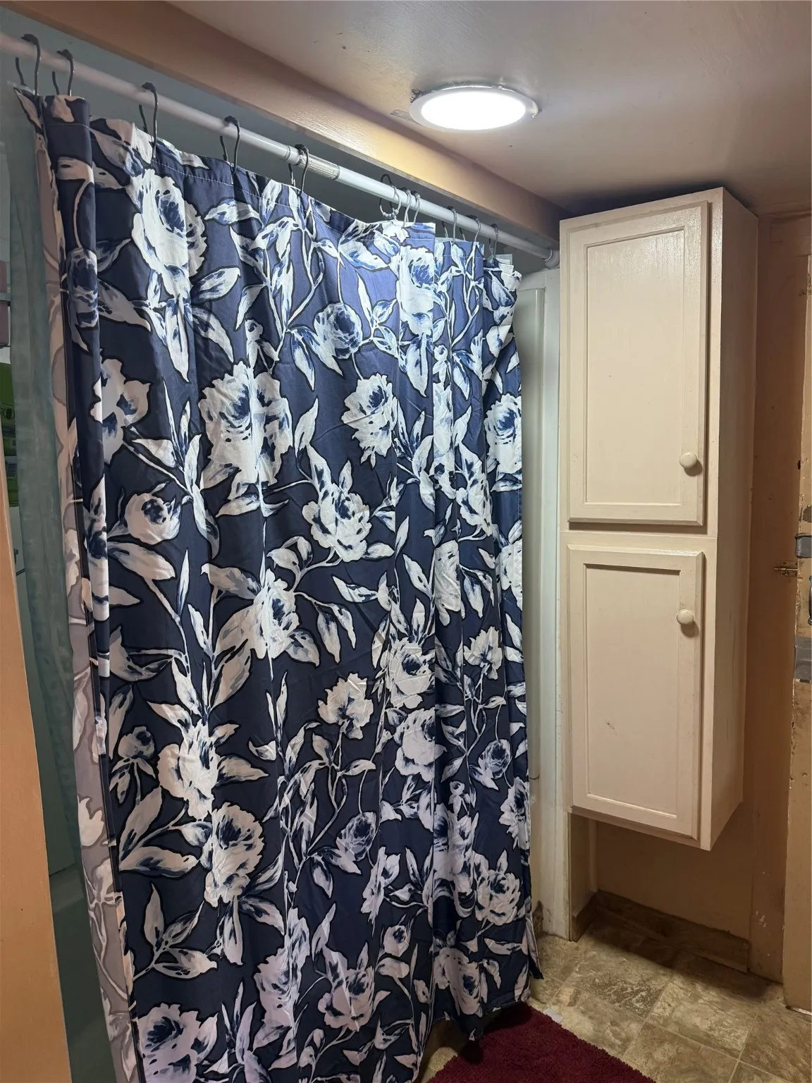 Bathroom featuring stone finish flooring