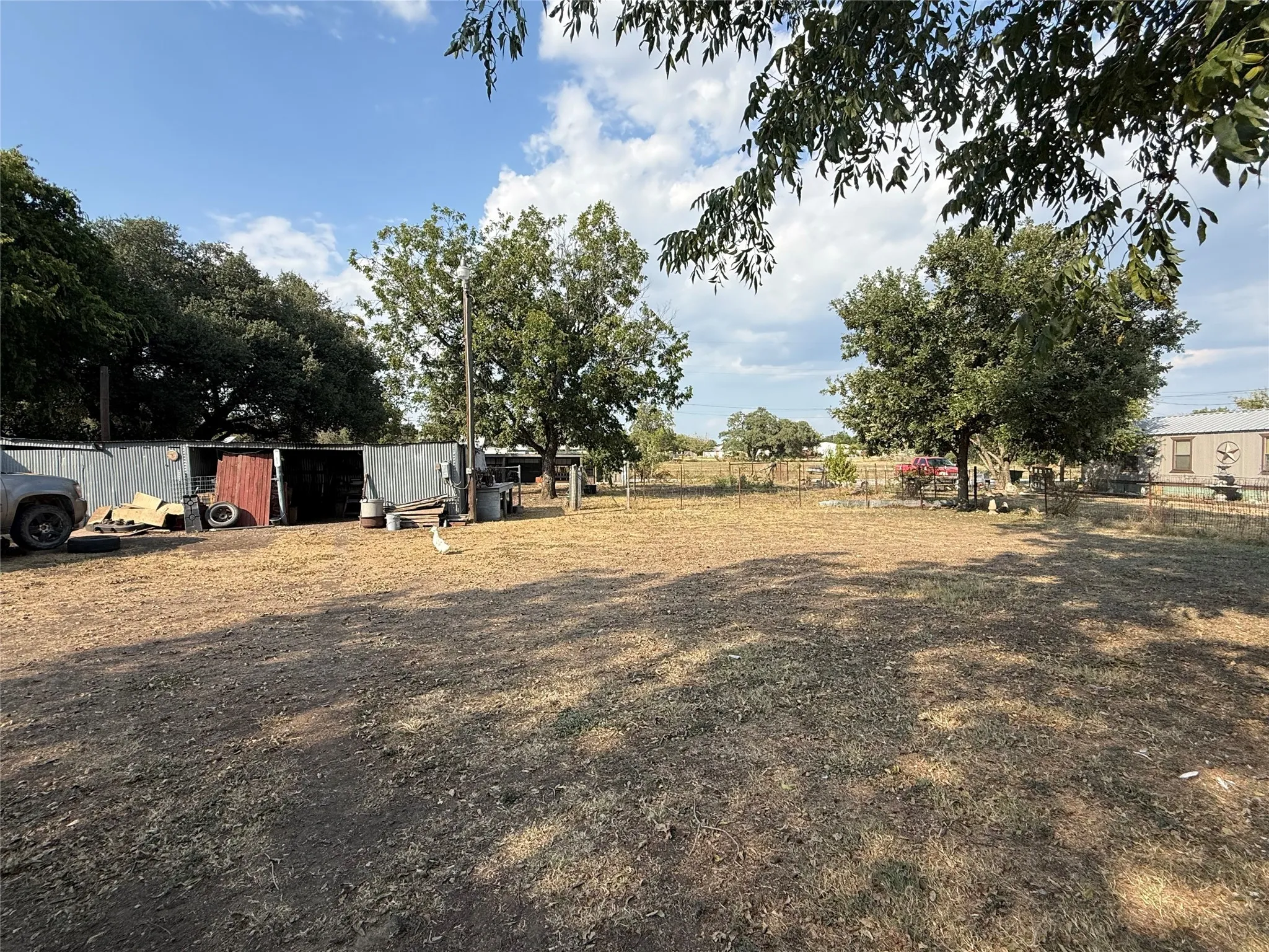 View of yard with an outbuilding and an outdoor structure