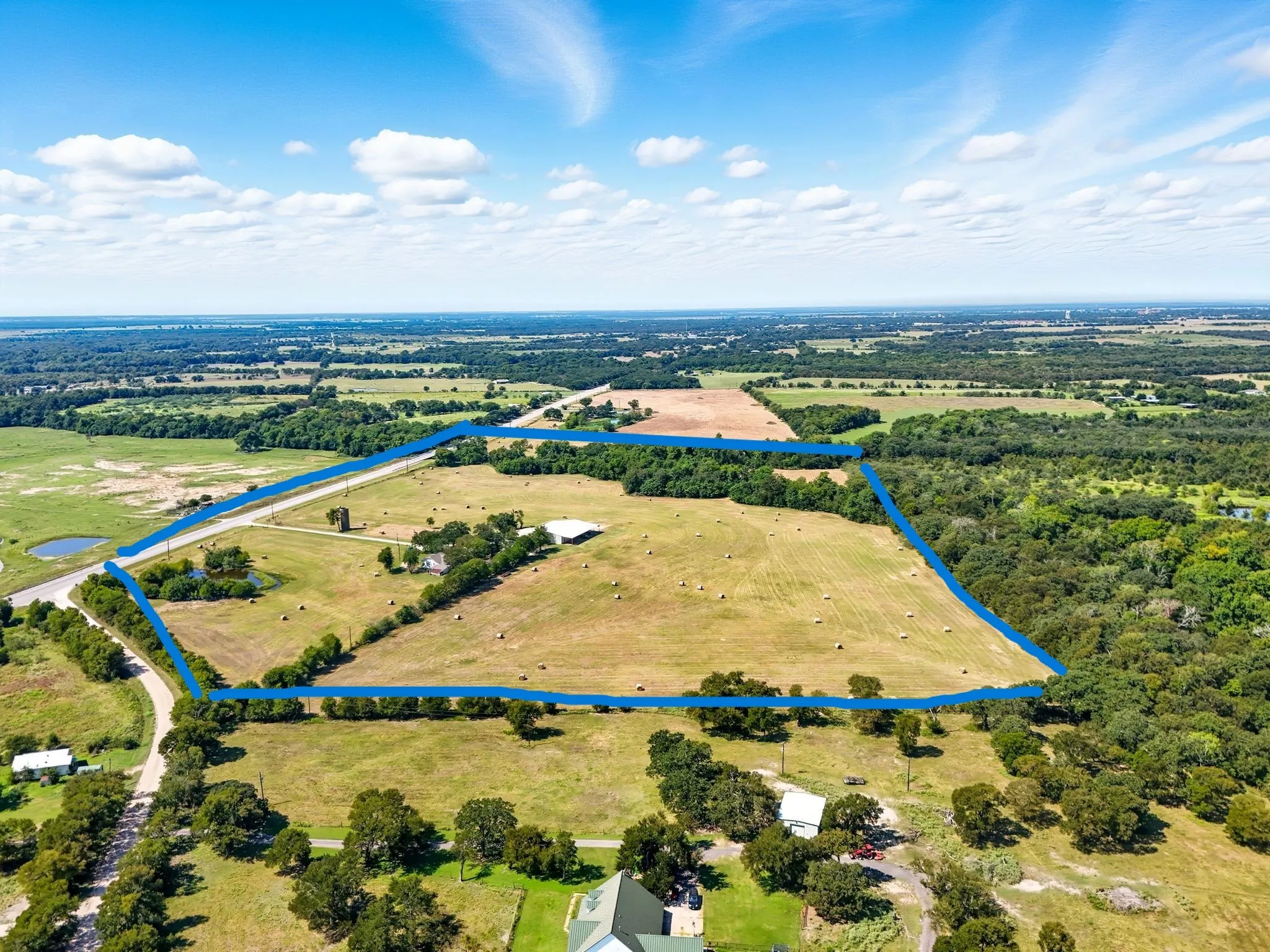 Aerial view of property's location featuring property parcel outlined