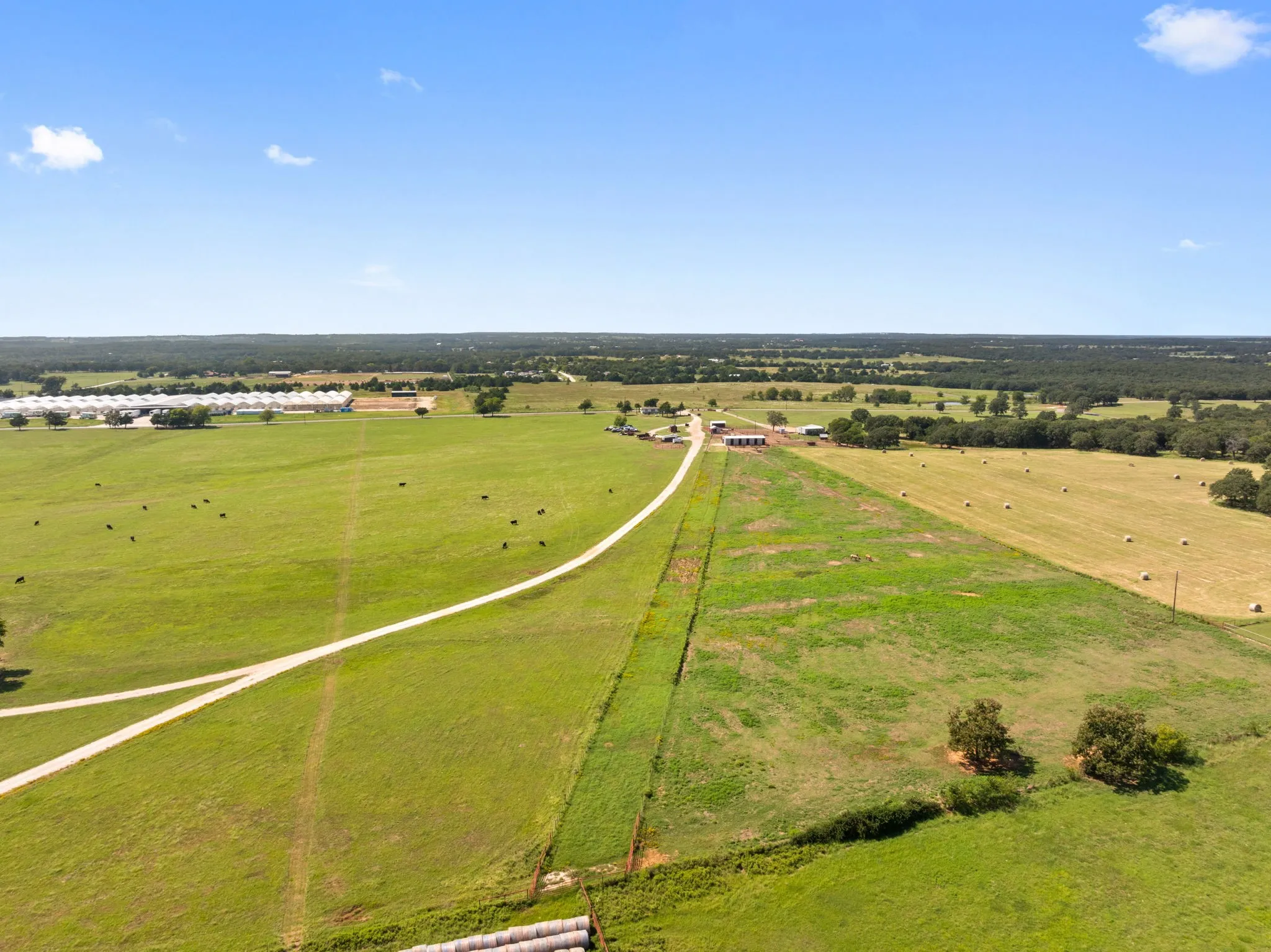 Aerial view of sparsely populated area with a pastoral area