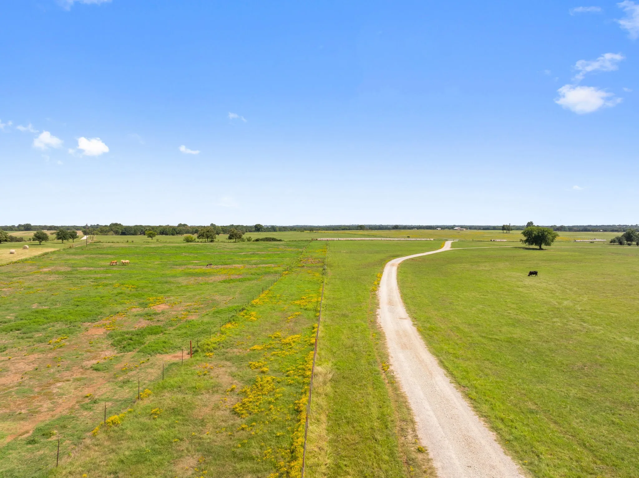 View of dirt / gravel road featuring a view of countryside