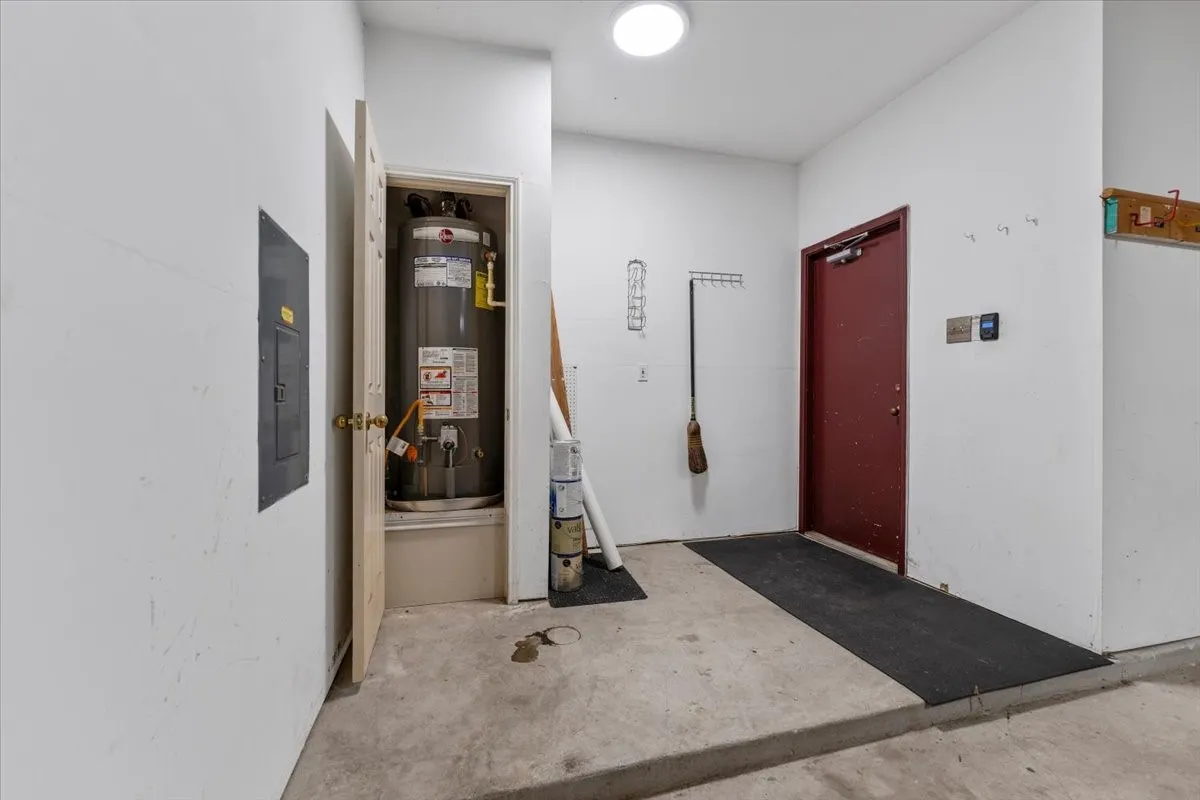 Utilities featuring water heater and electric panel