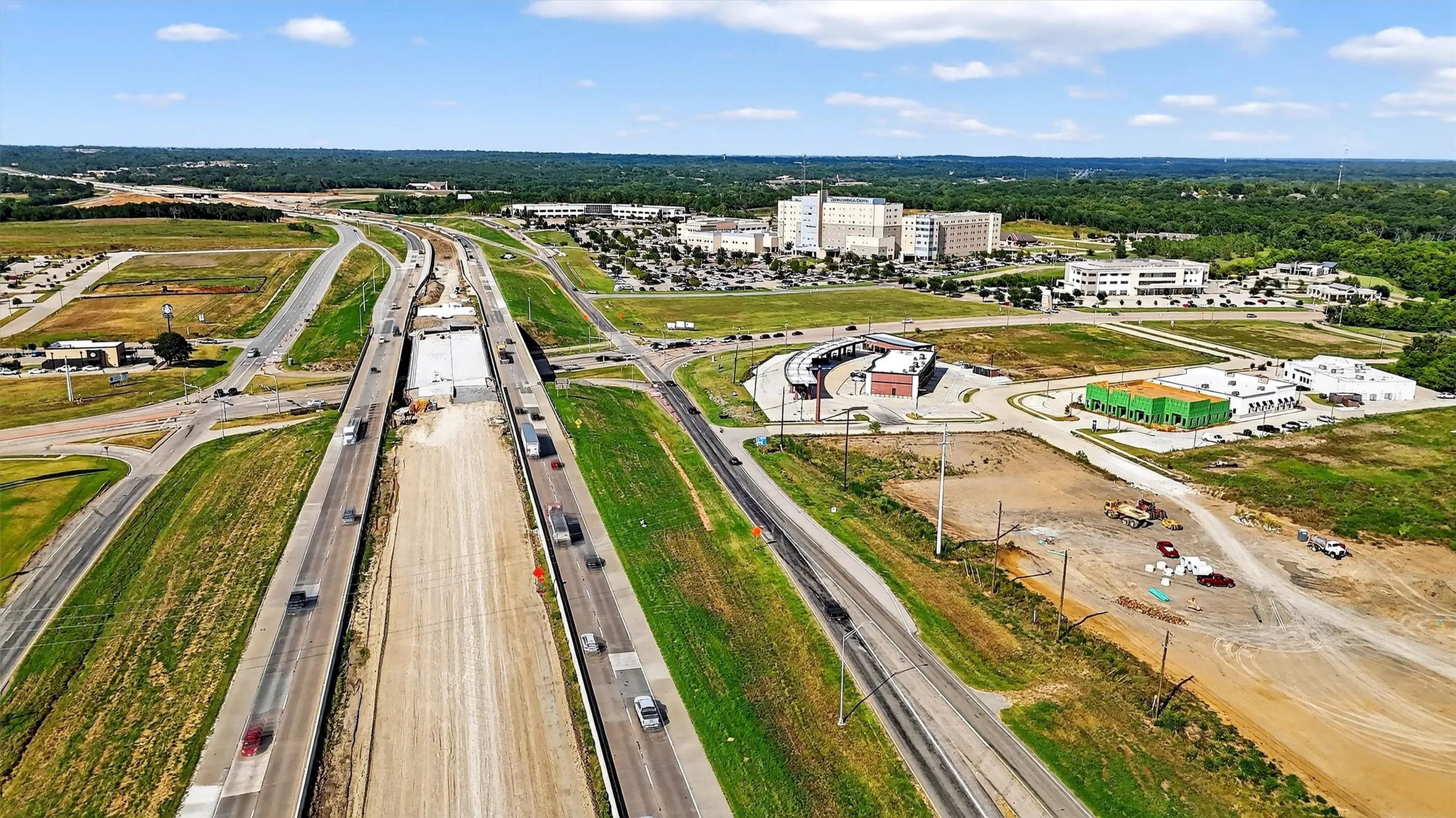 Aerial overview of property's location with a main thoroughfare