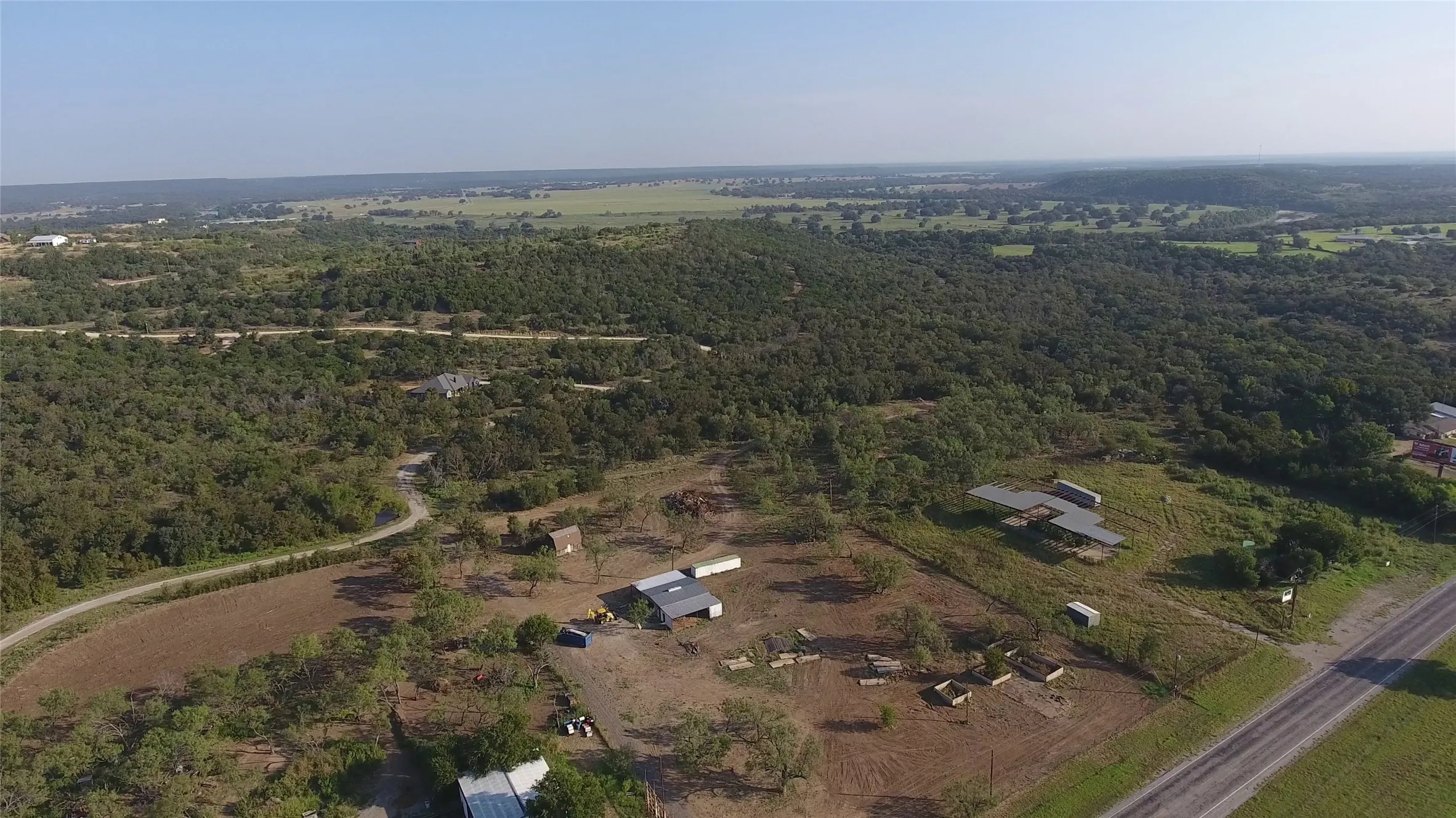 Aerial overview of property's location with a forest