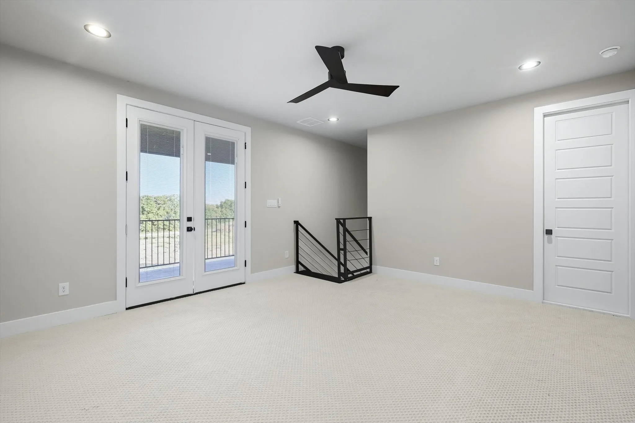 Carpeted empty room with recessed lighting, french doors, and ceiling fan