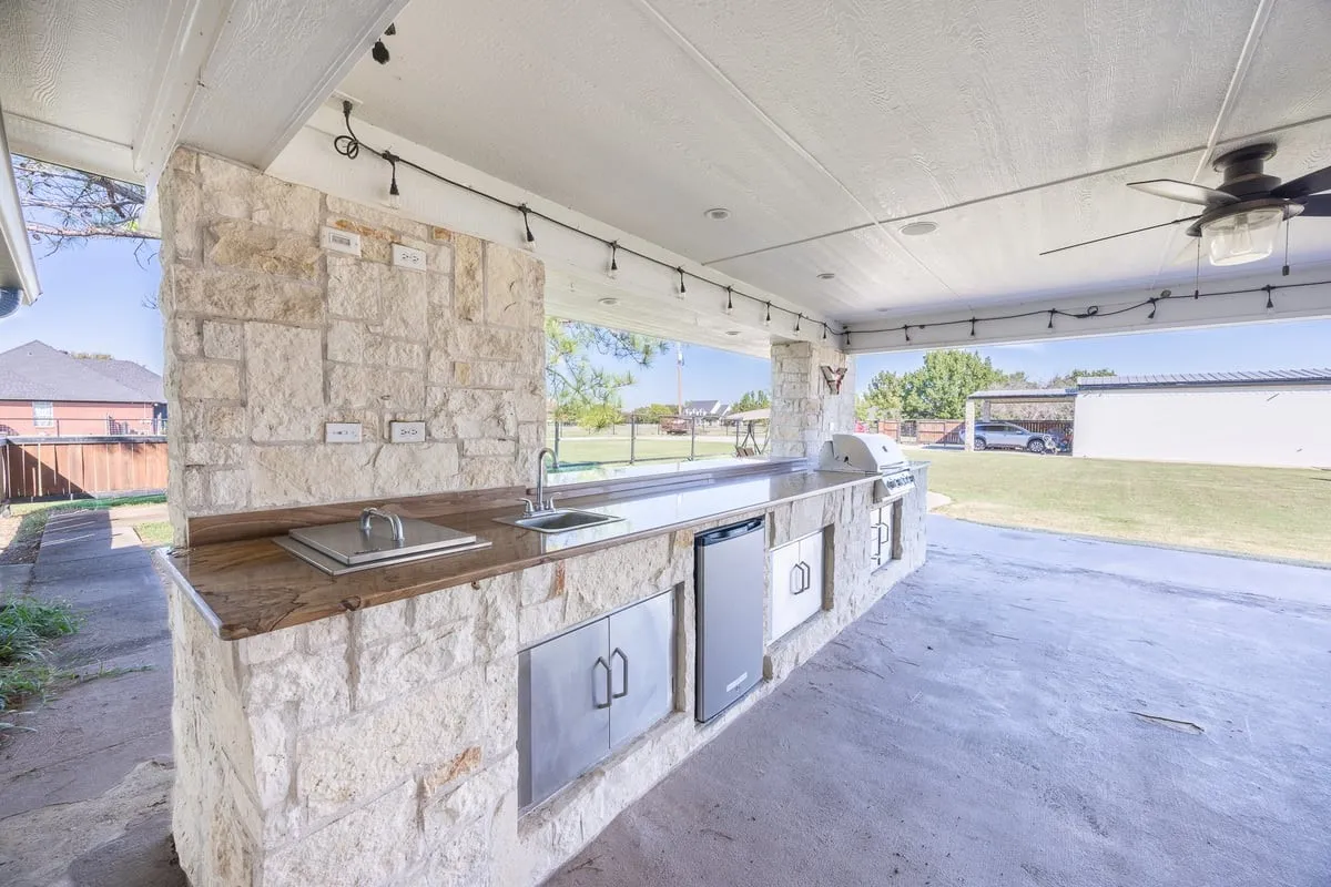 Main House: Outdoor kitchen under covered patio.