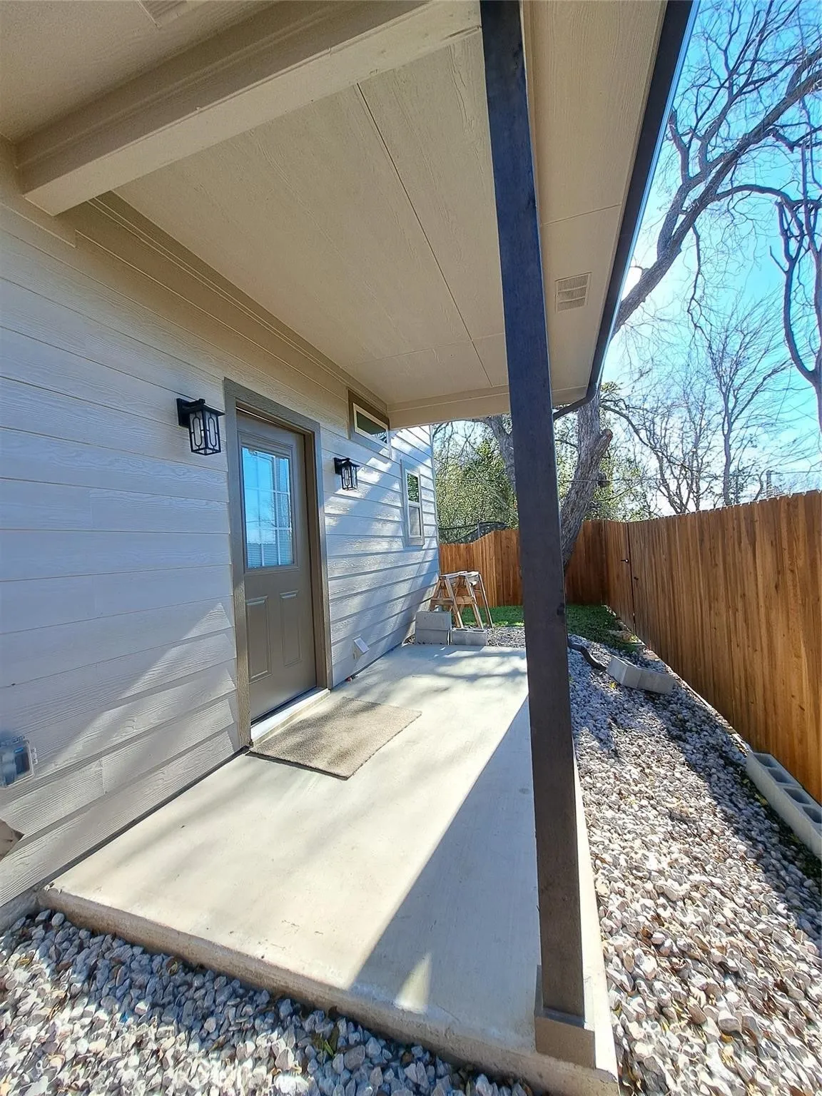Fenced backyard featuring a patio