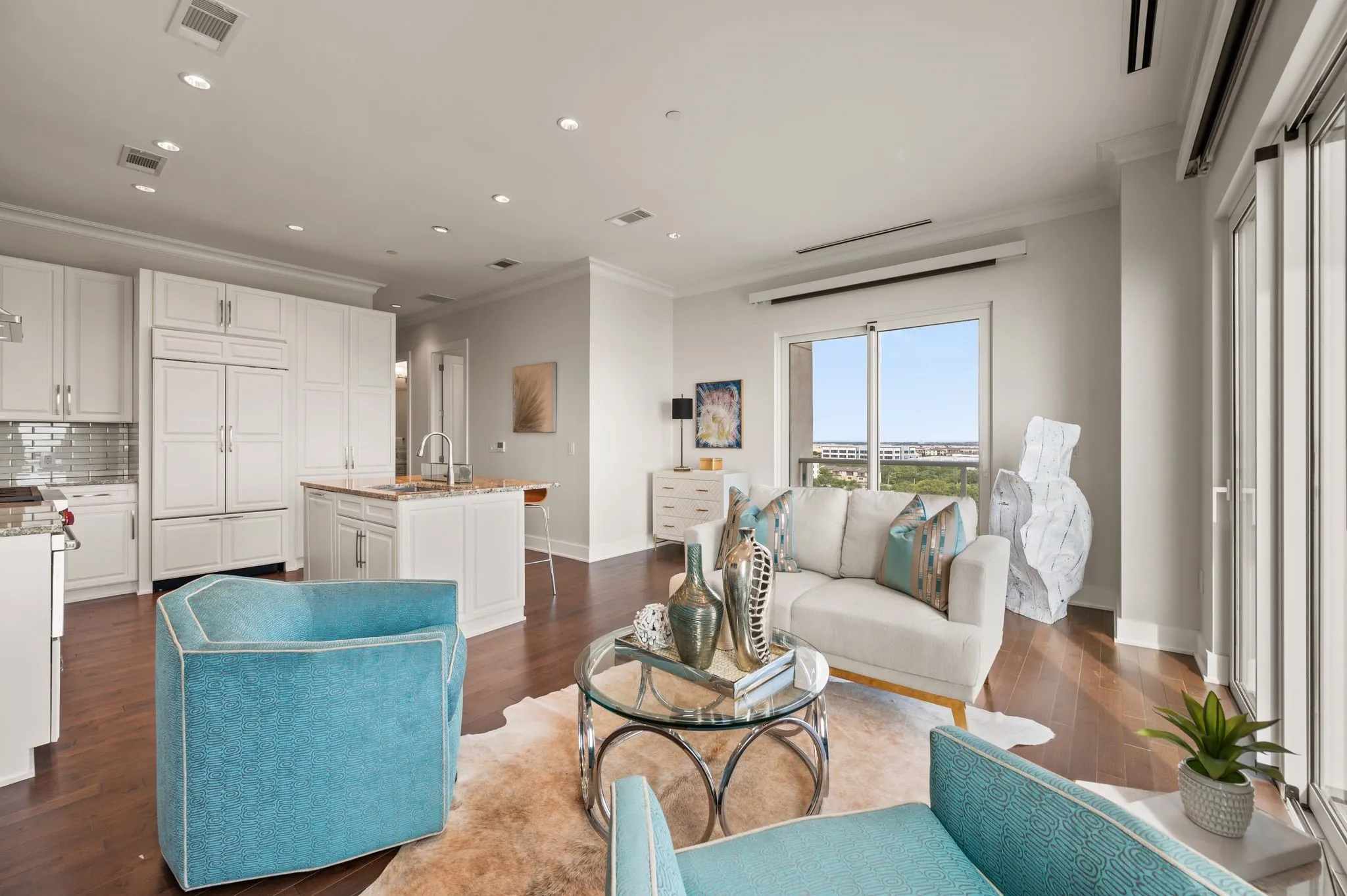 Living area with ornamental molding, recessed lighting, and dark wood-style flooring
