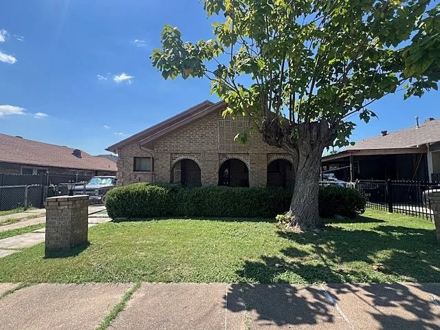 View of front of house featuring brick siding