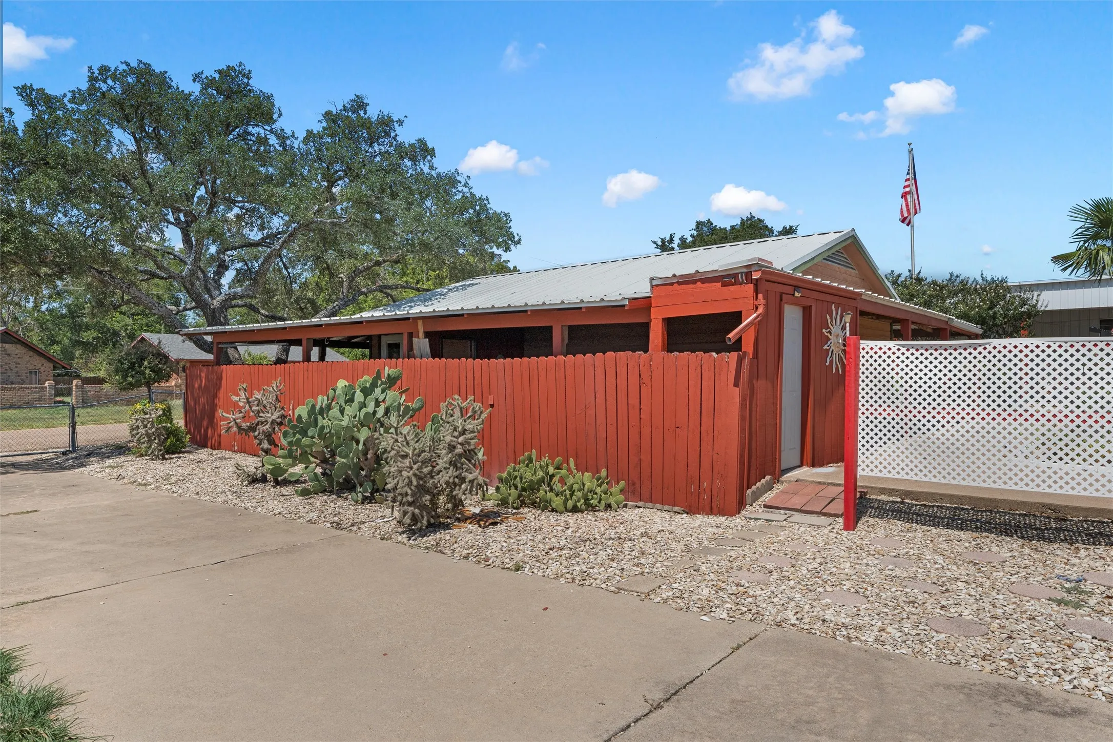 View of property exterior with a metal roof