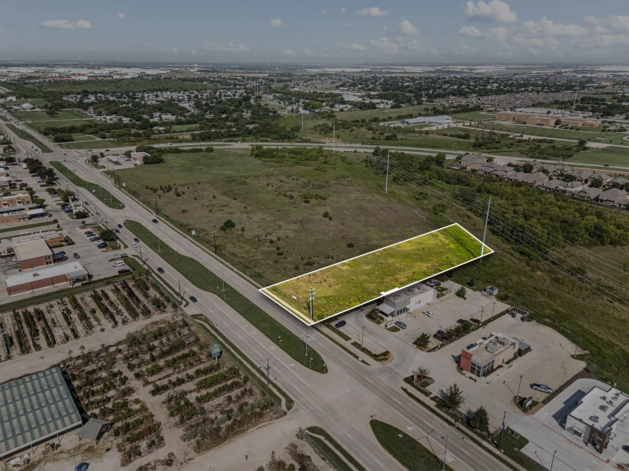 Aerial view of property and surrounding area with property parcel outlined