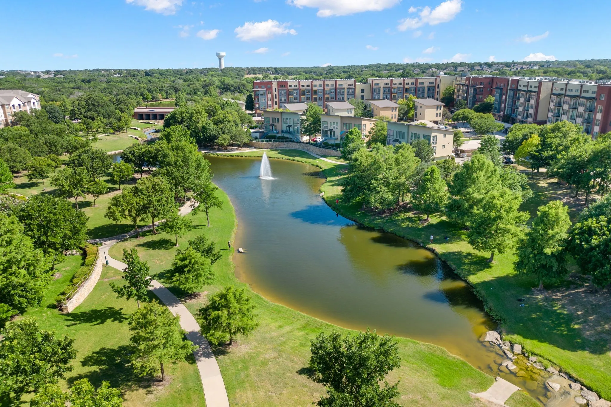 Bird's eye view of a large body of water and apartment complex