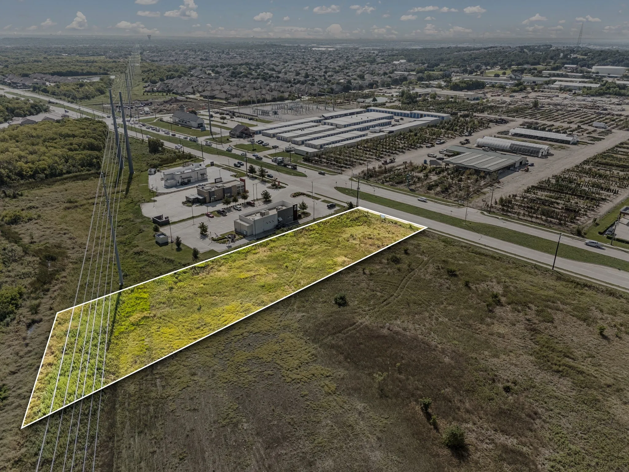 Aerial overview of property's location featuring property parcel outlined