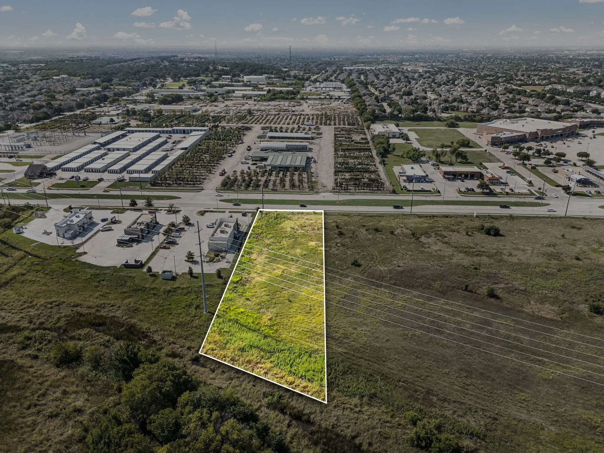 Aerial view of property and surrounding area featuring property boundaries highlighted