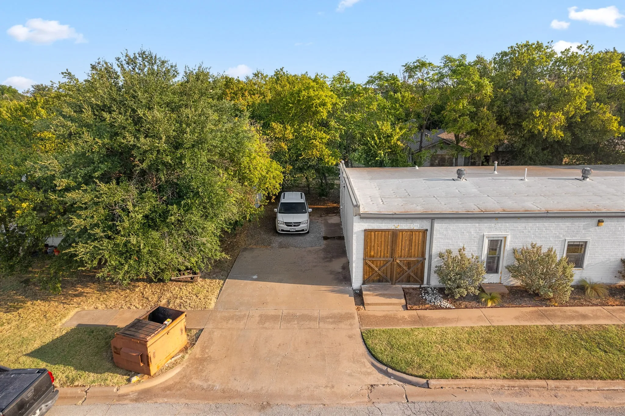 View of front of house featuring concrete driveway