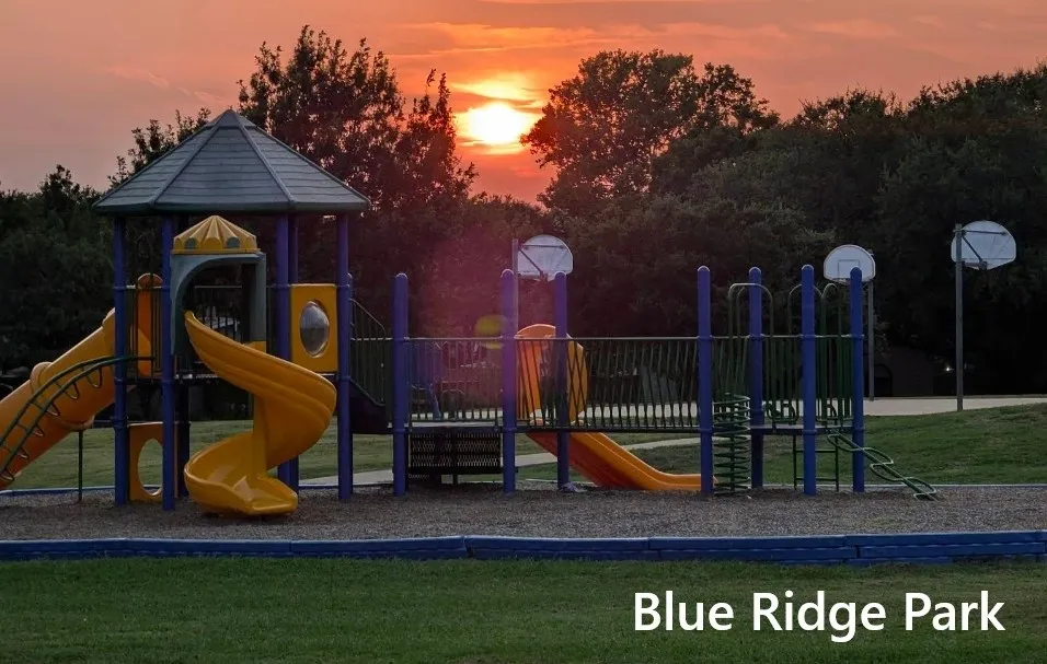 Playground at dusk featuring a lawn
