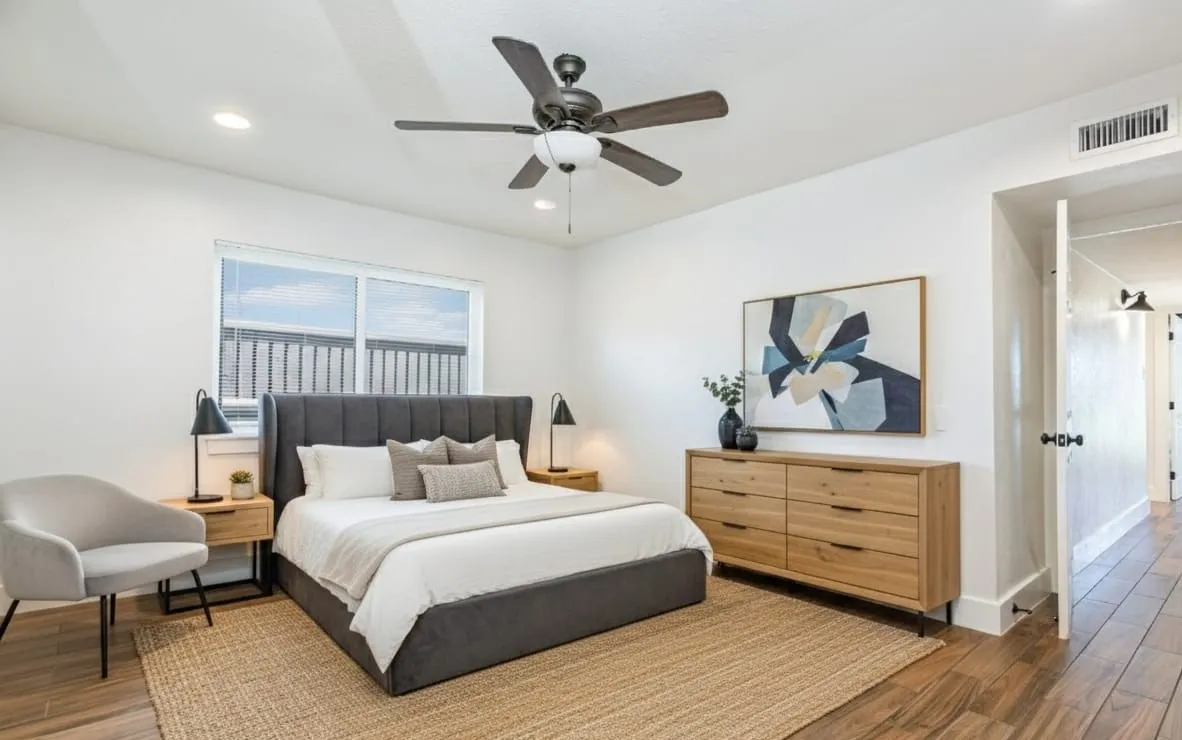 Bedroom with wood finished floors, a ceiling fan, and recessed lighting