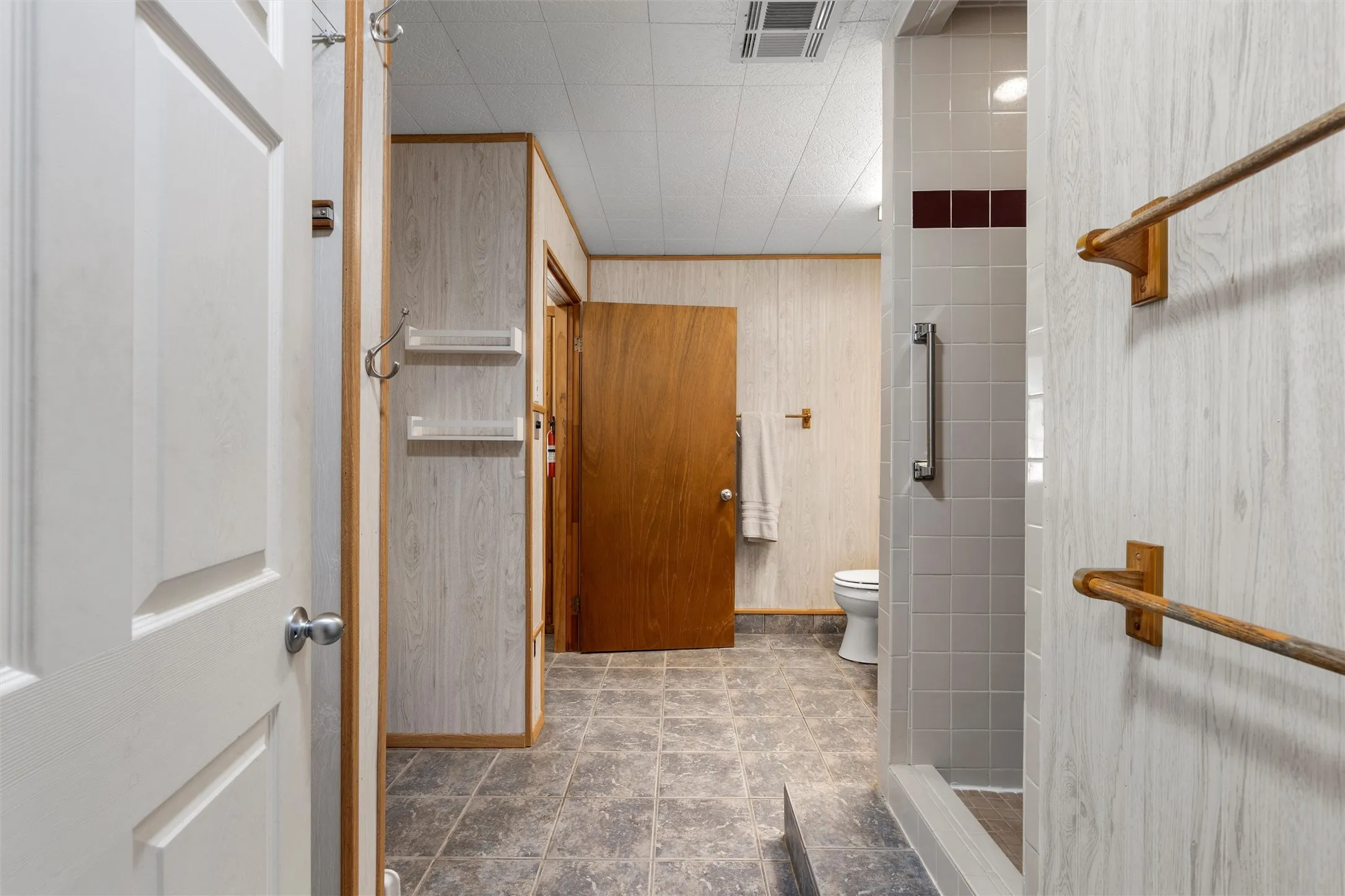 Bathroom with a stall shower and toilet