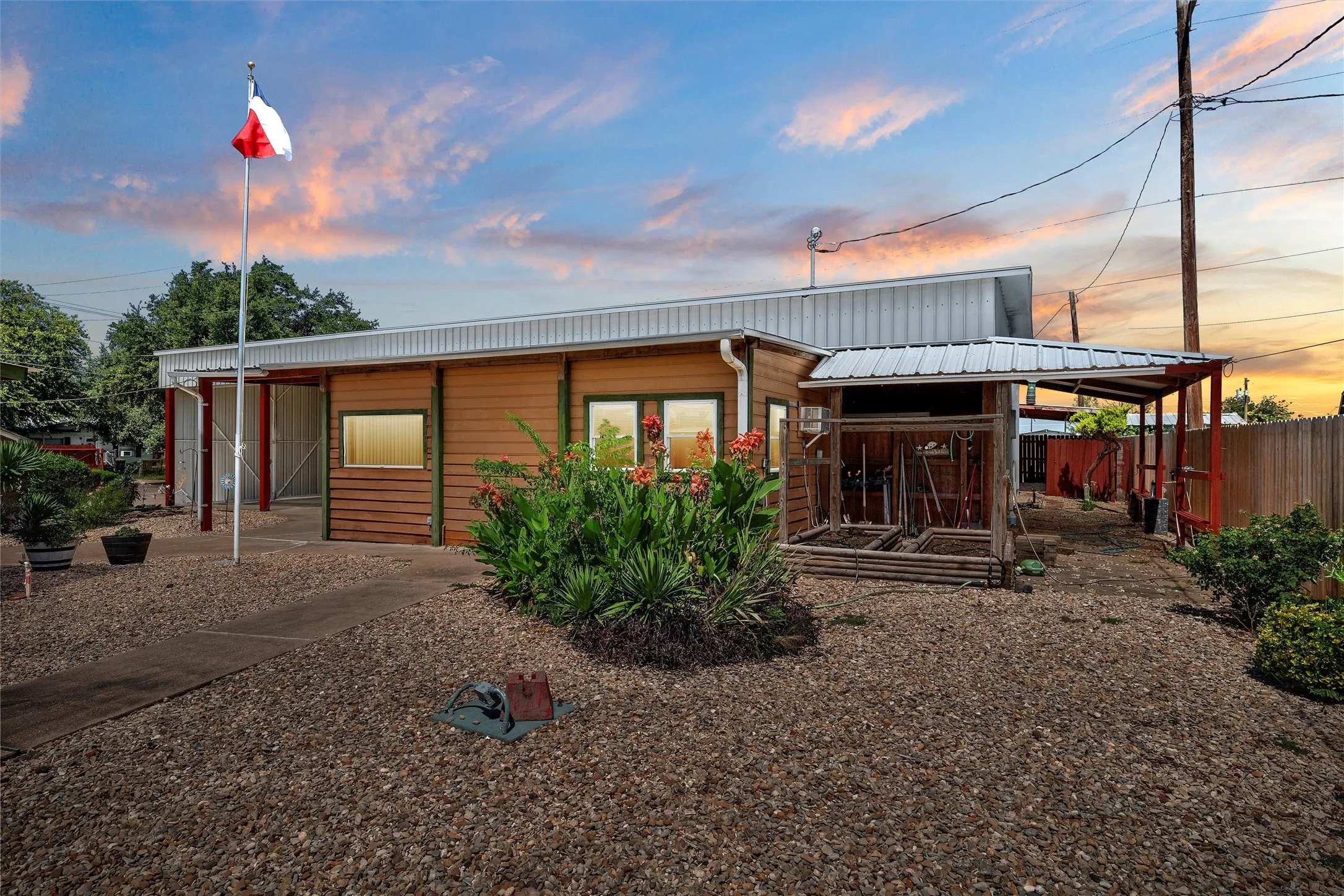 View of back of property at dusk