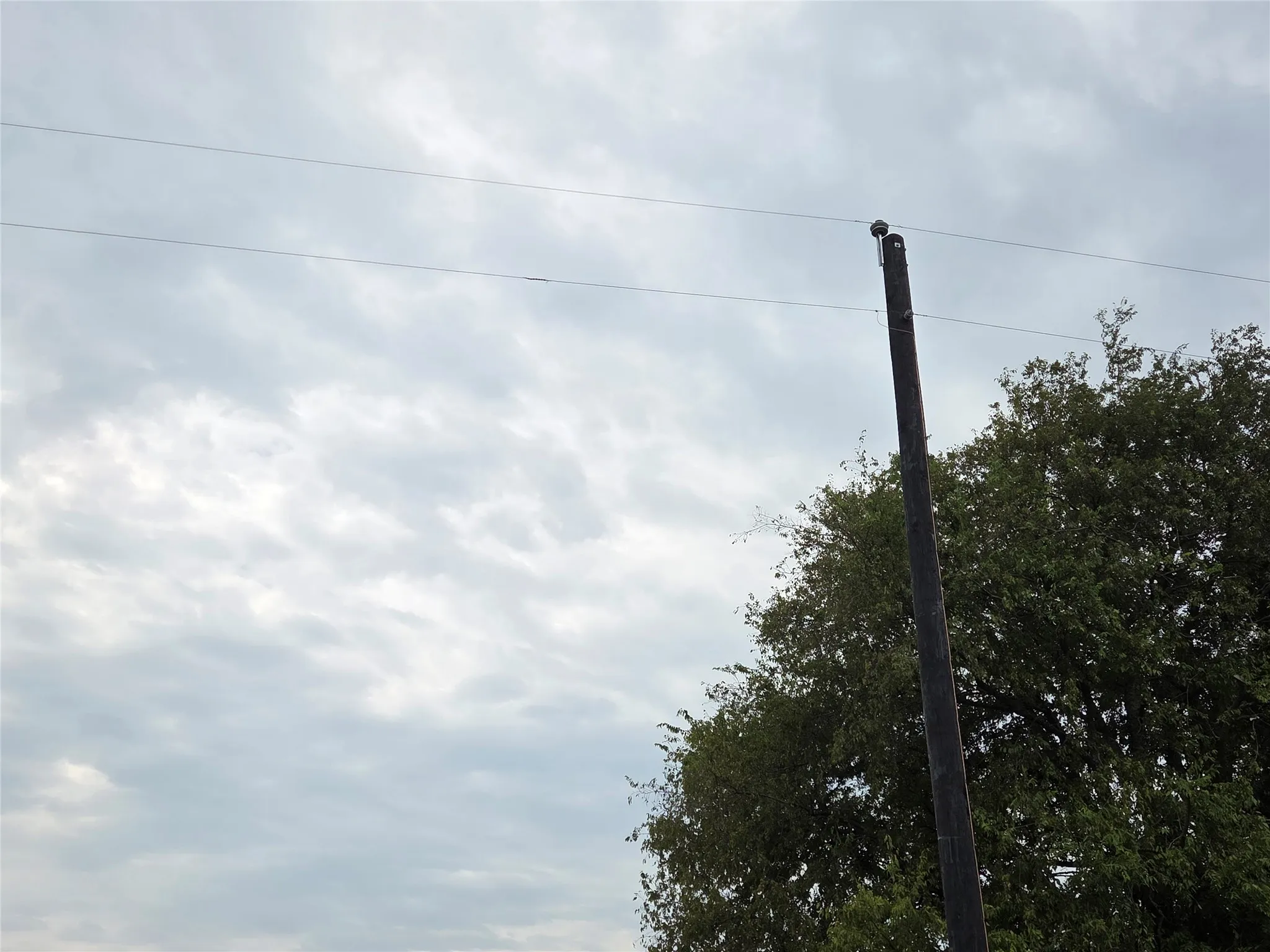 Electric Pole is the North Property Line.