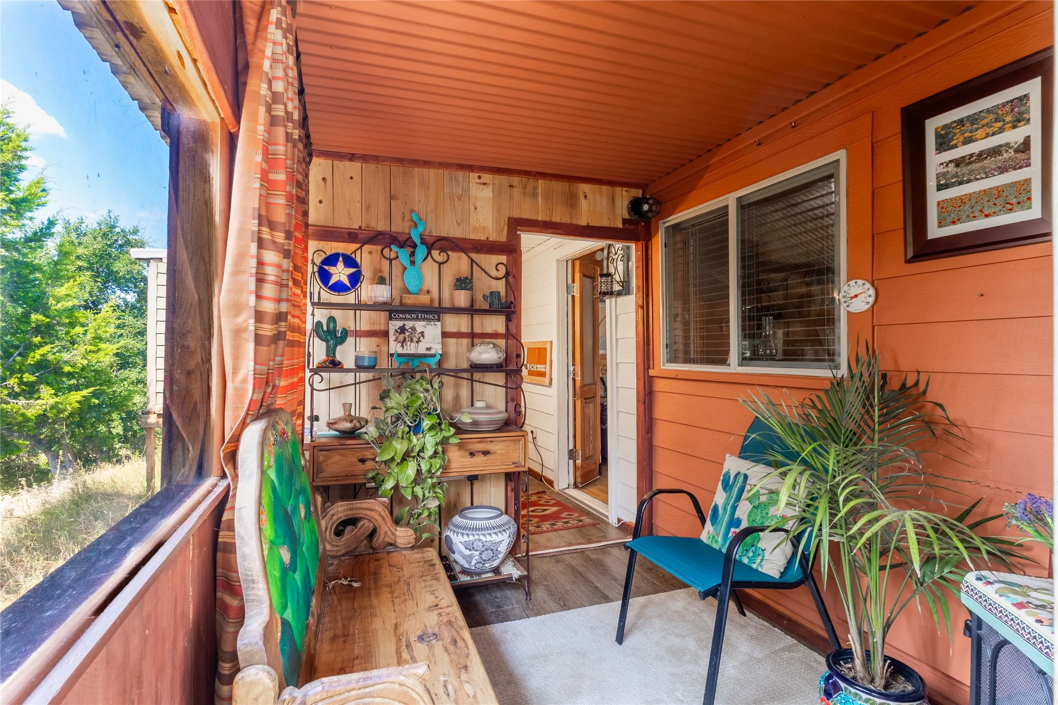 Step into the enclosed sunroom to relax a while.