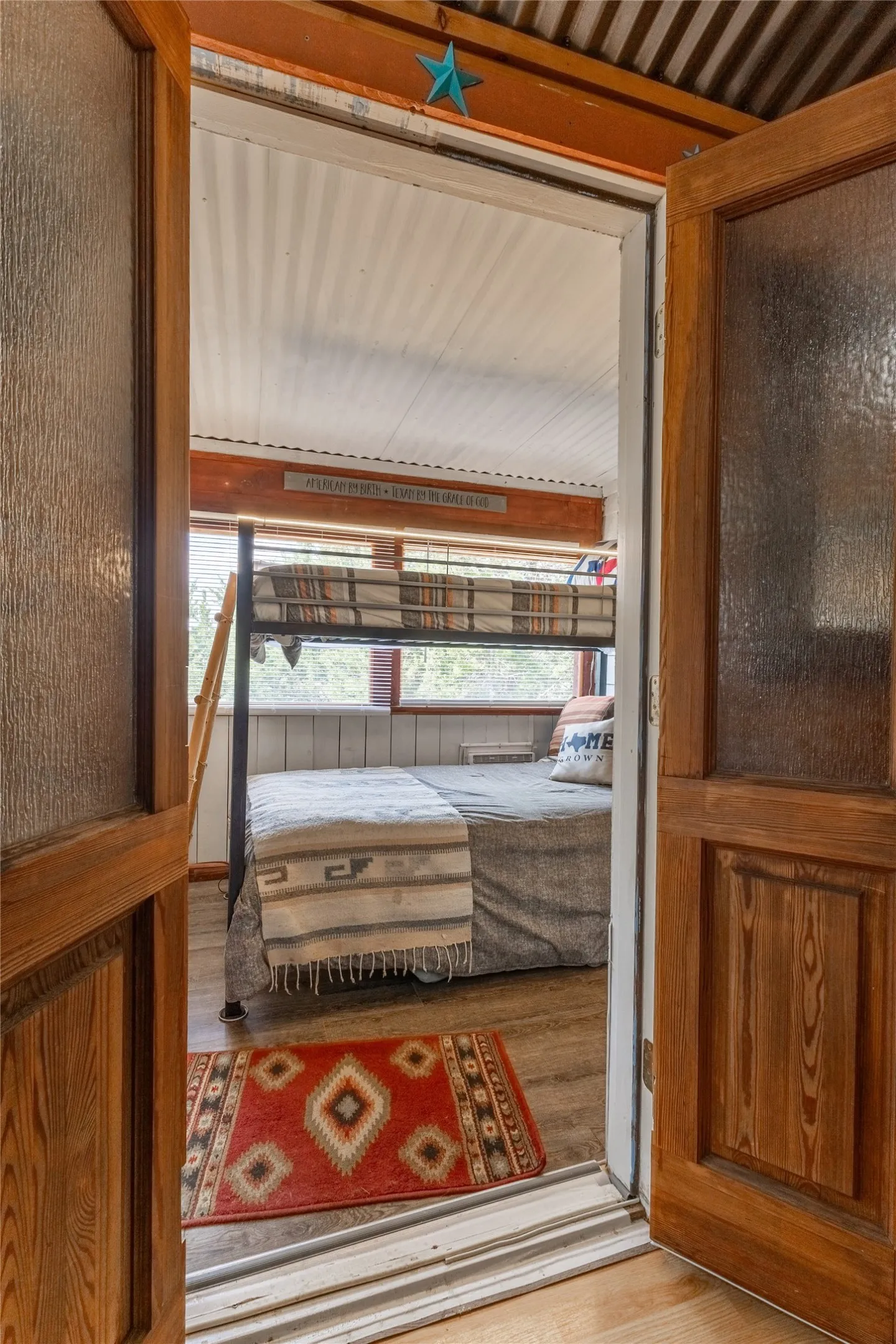 Doors separating the rooms feature frosted glass for added privacy.