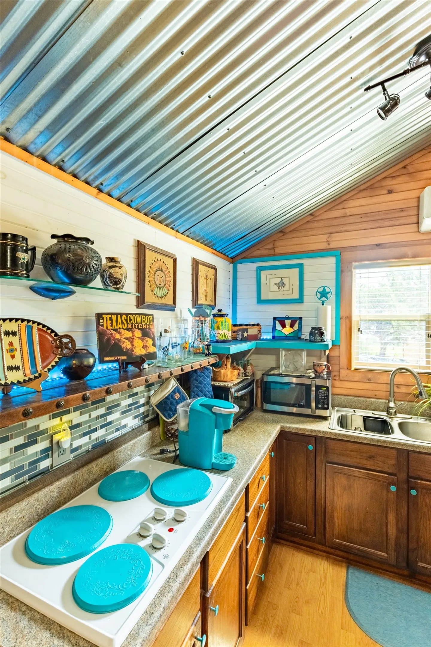 Electric cooktop and open shelving make this kitchen so easy to work in.