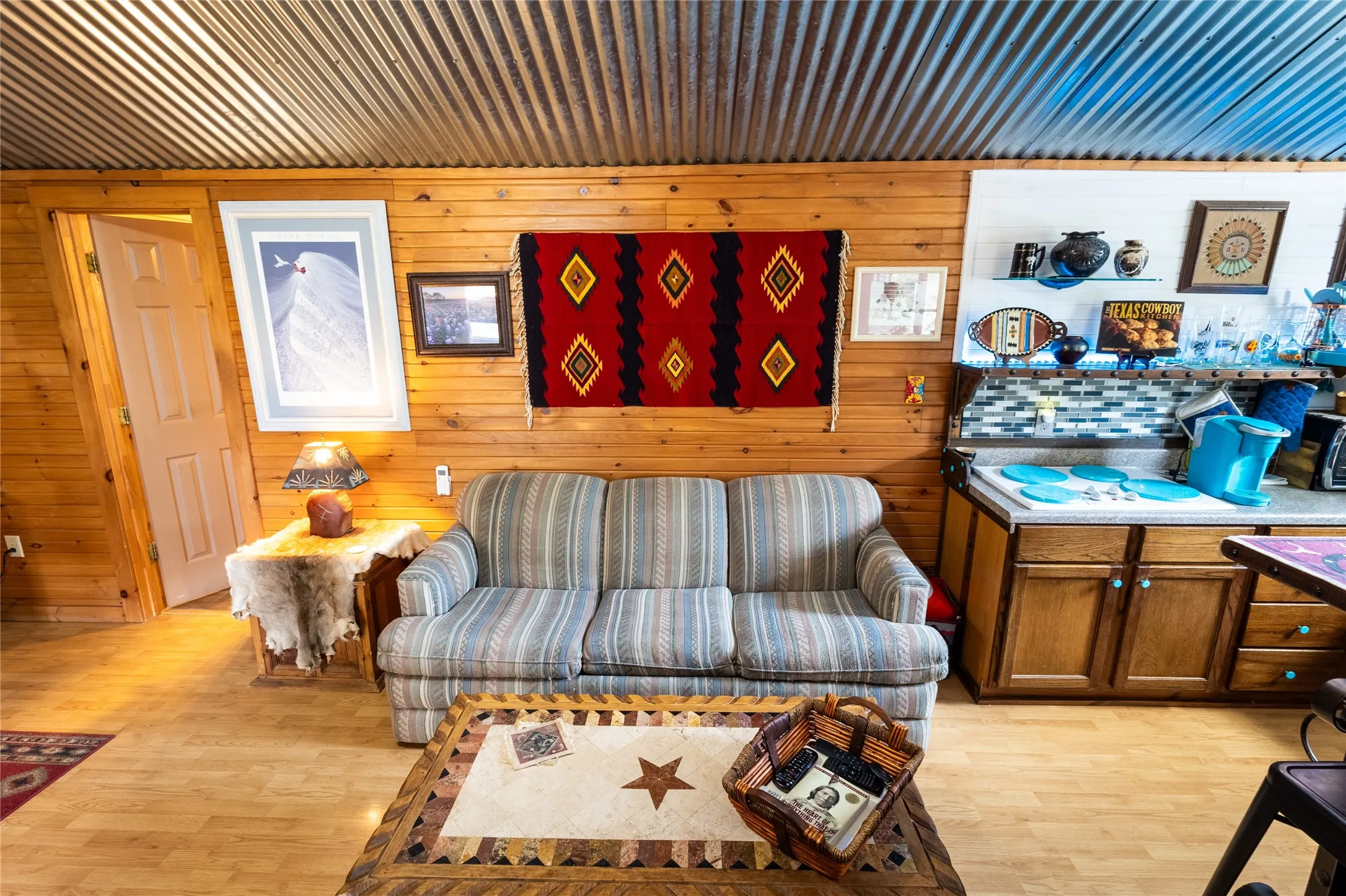 Warm wood on the walls an wood-look floors make this such cozy space.
