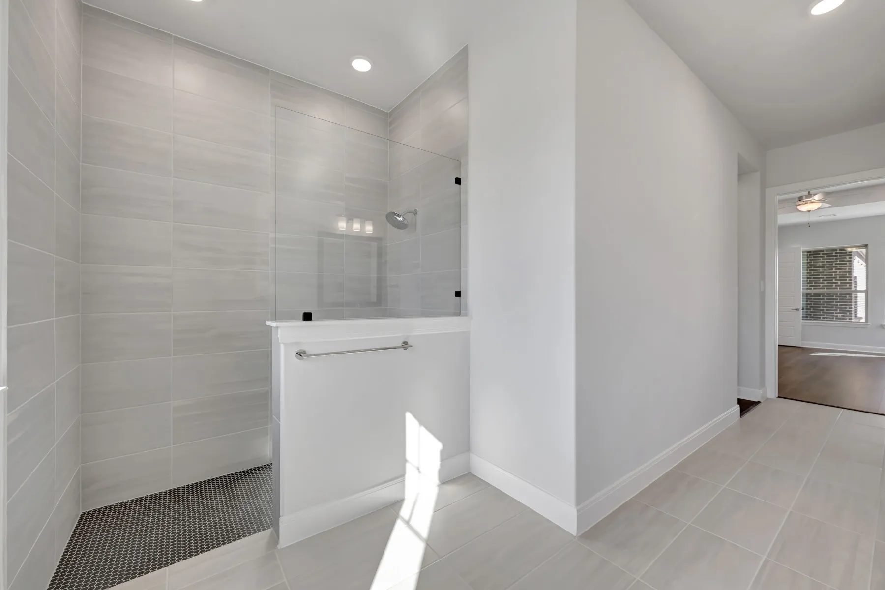 Bathroom with walk in shower and recessed lighting