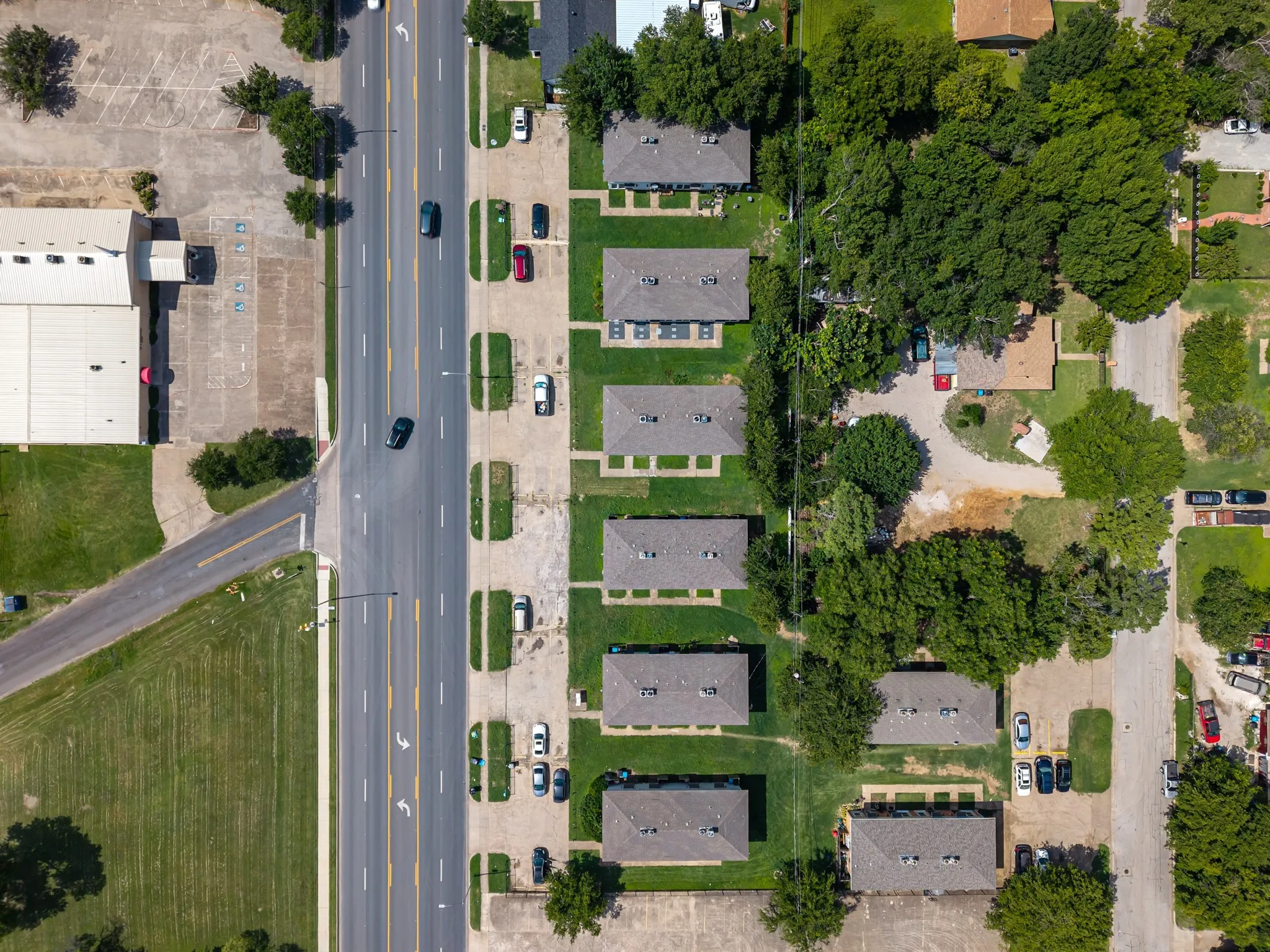 Aerial view of property's location with nearby suburban area