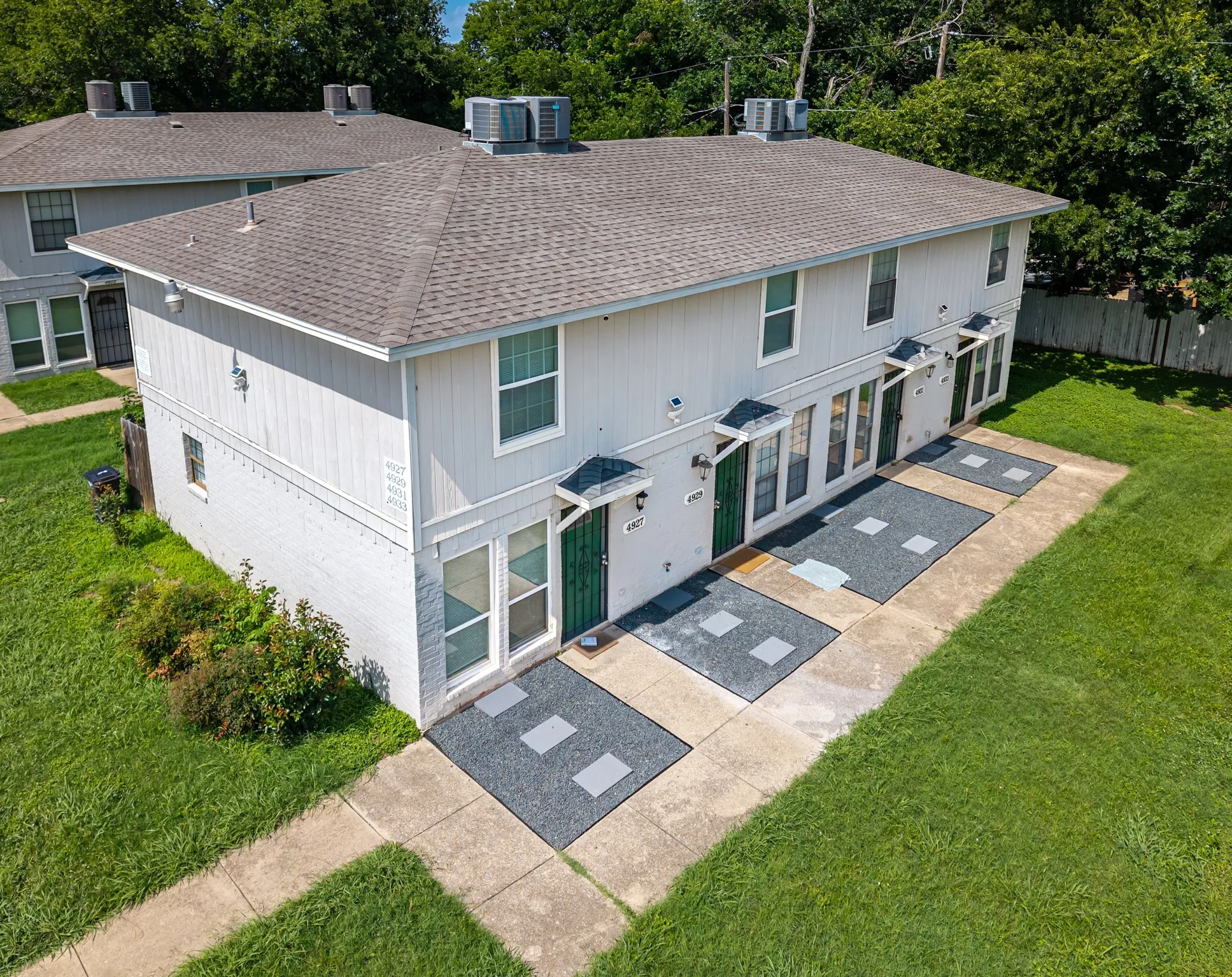 View of front of house with a shingled roof