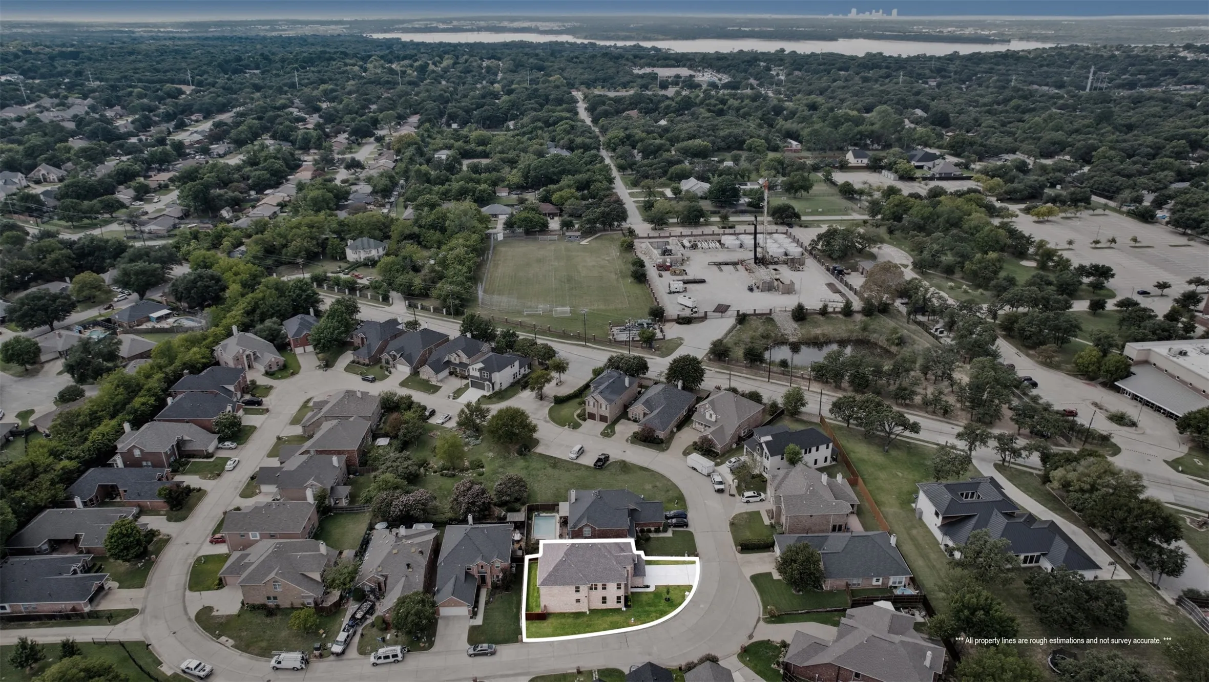 View of property location with a large body of water and nearby suburban area