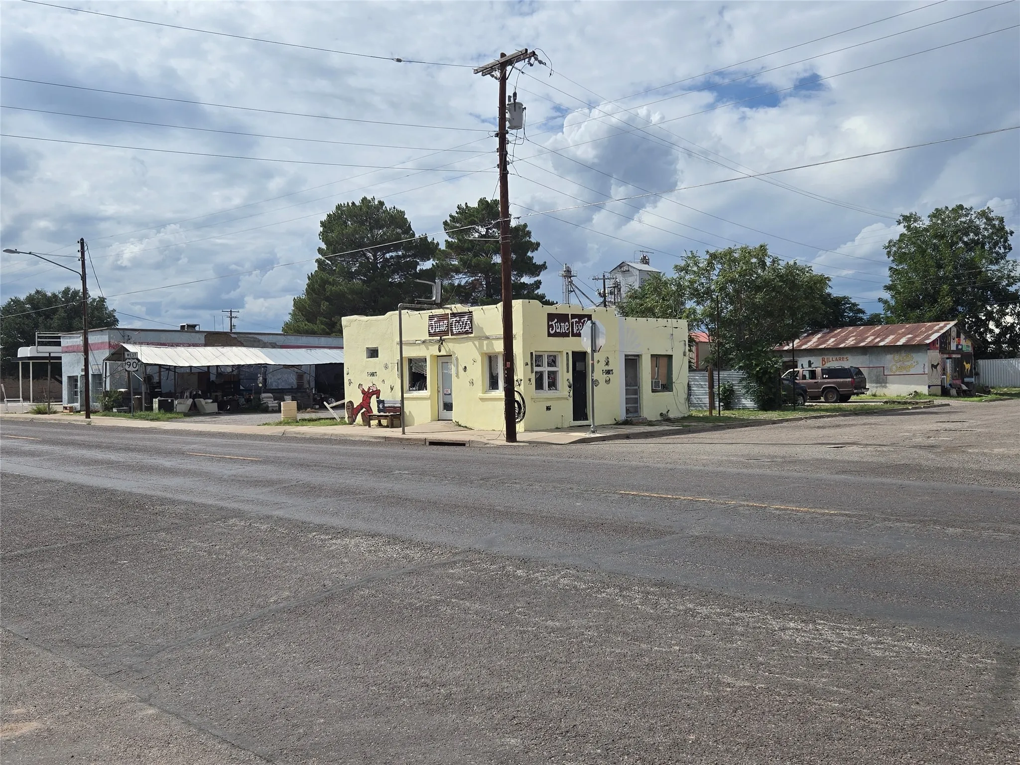 View of asphalt street with street lighting