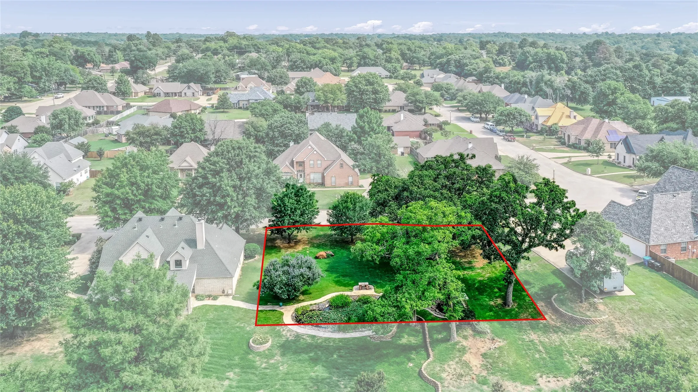 Aerial perspective of suburban area with property boundaries highlighted