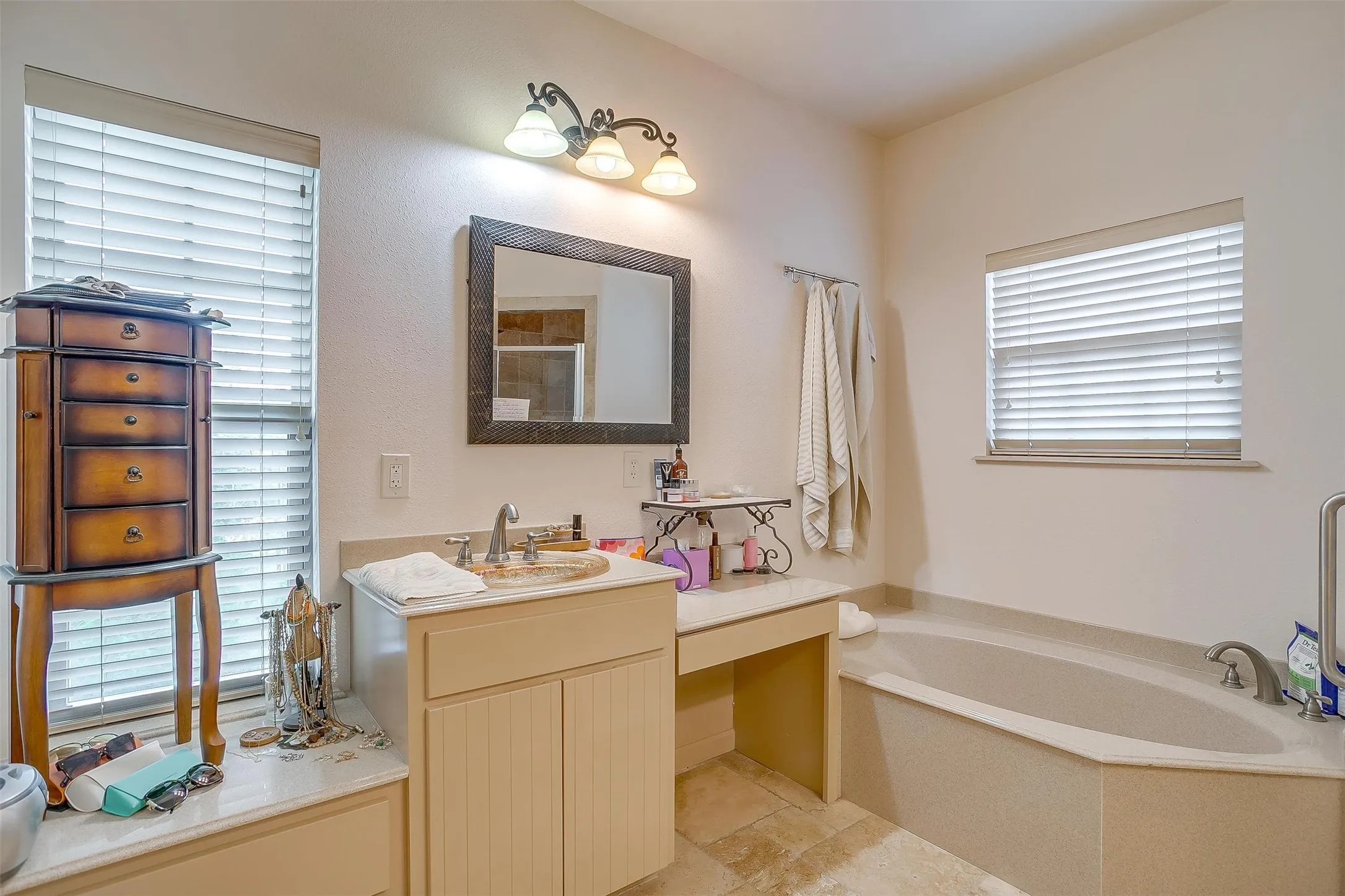 Full bath featuring a bath, a stall shower, and vanity
