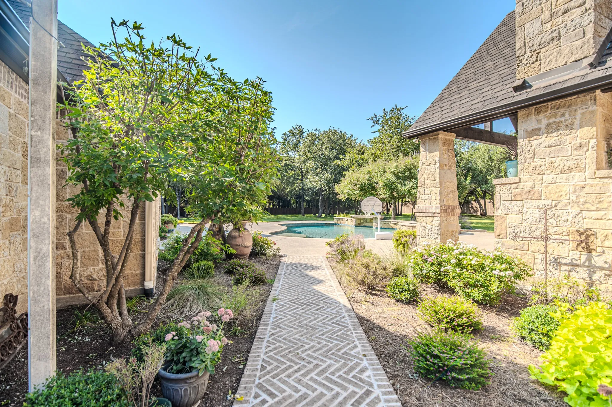 Gate and sidewalk to pool from side drive