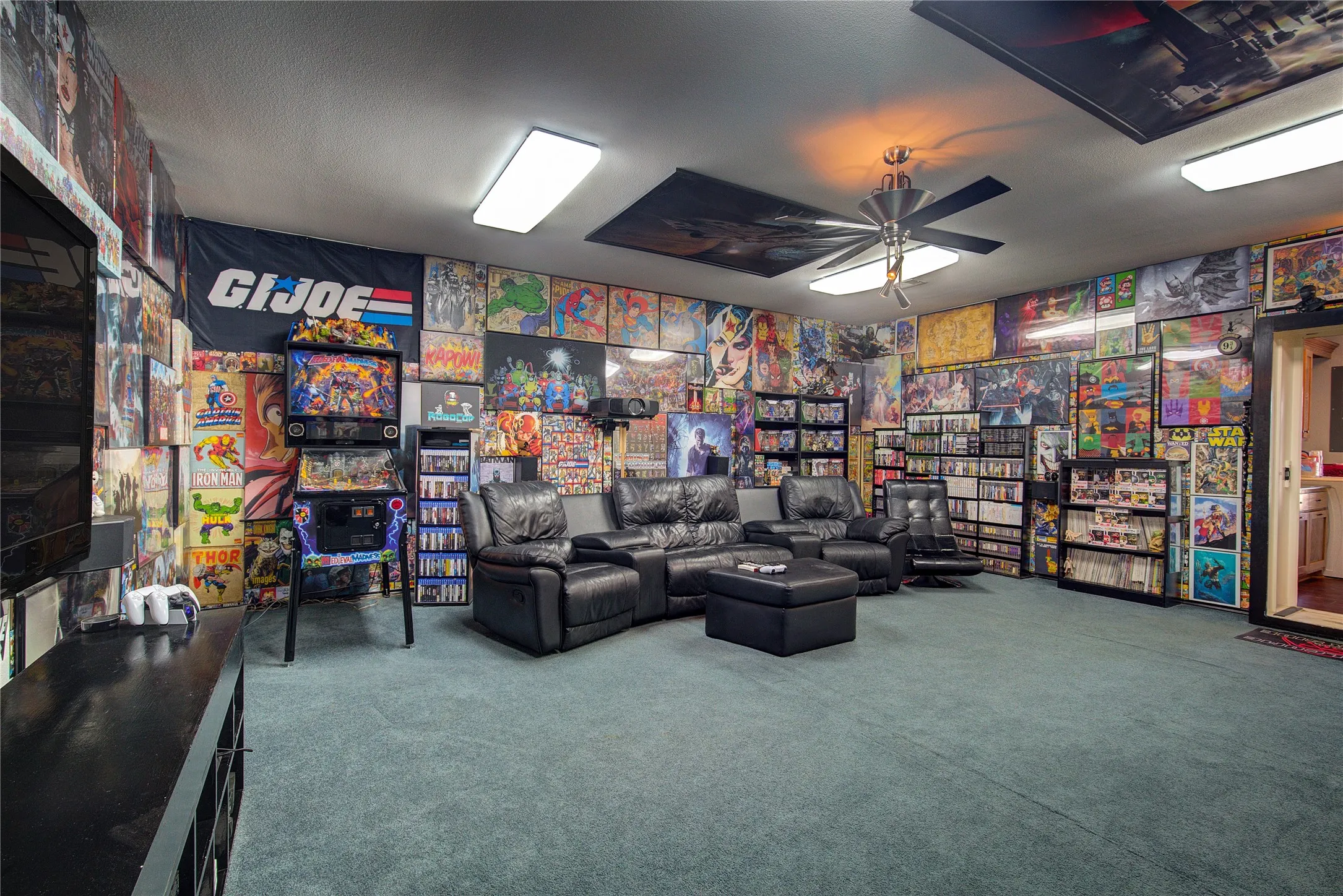 Living area featuring carpet and ceiling fan
