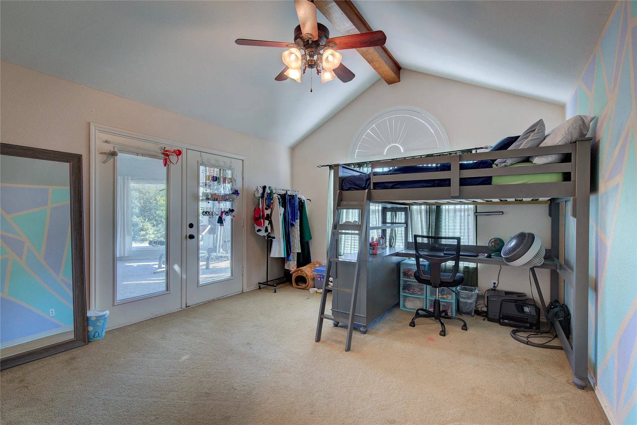 Carpeted bedroom with access to exterior, ceiling fan, french doors, and lofted ceiling with beams