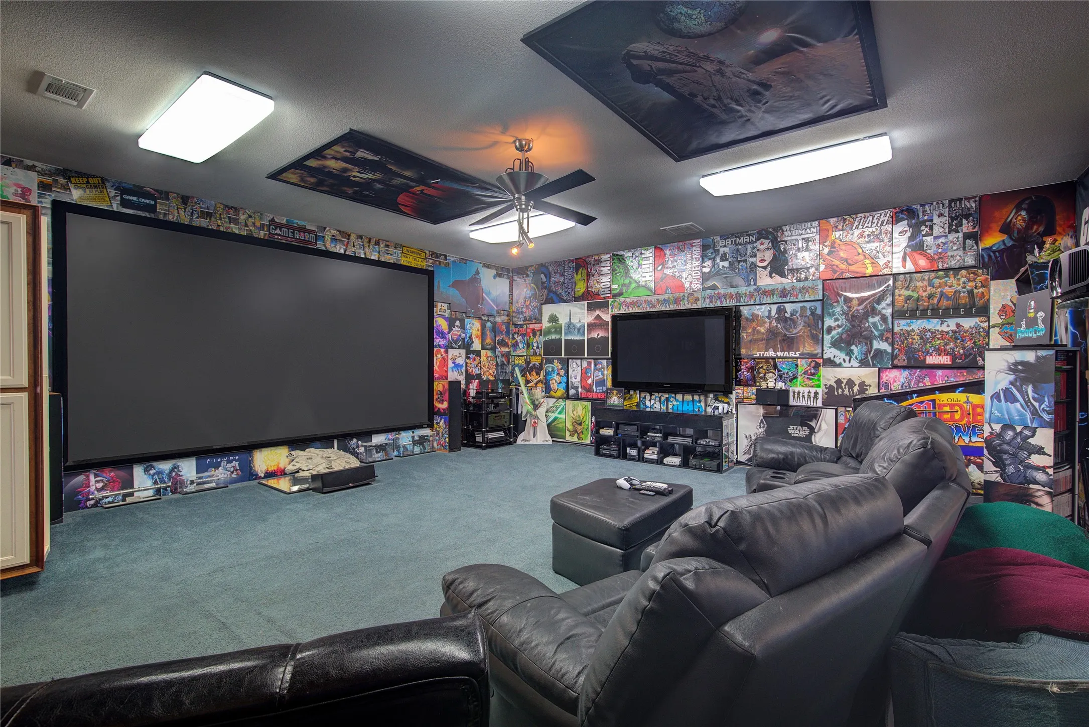 Carpeted living room featuring ceiling fan