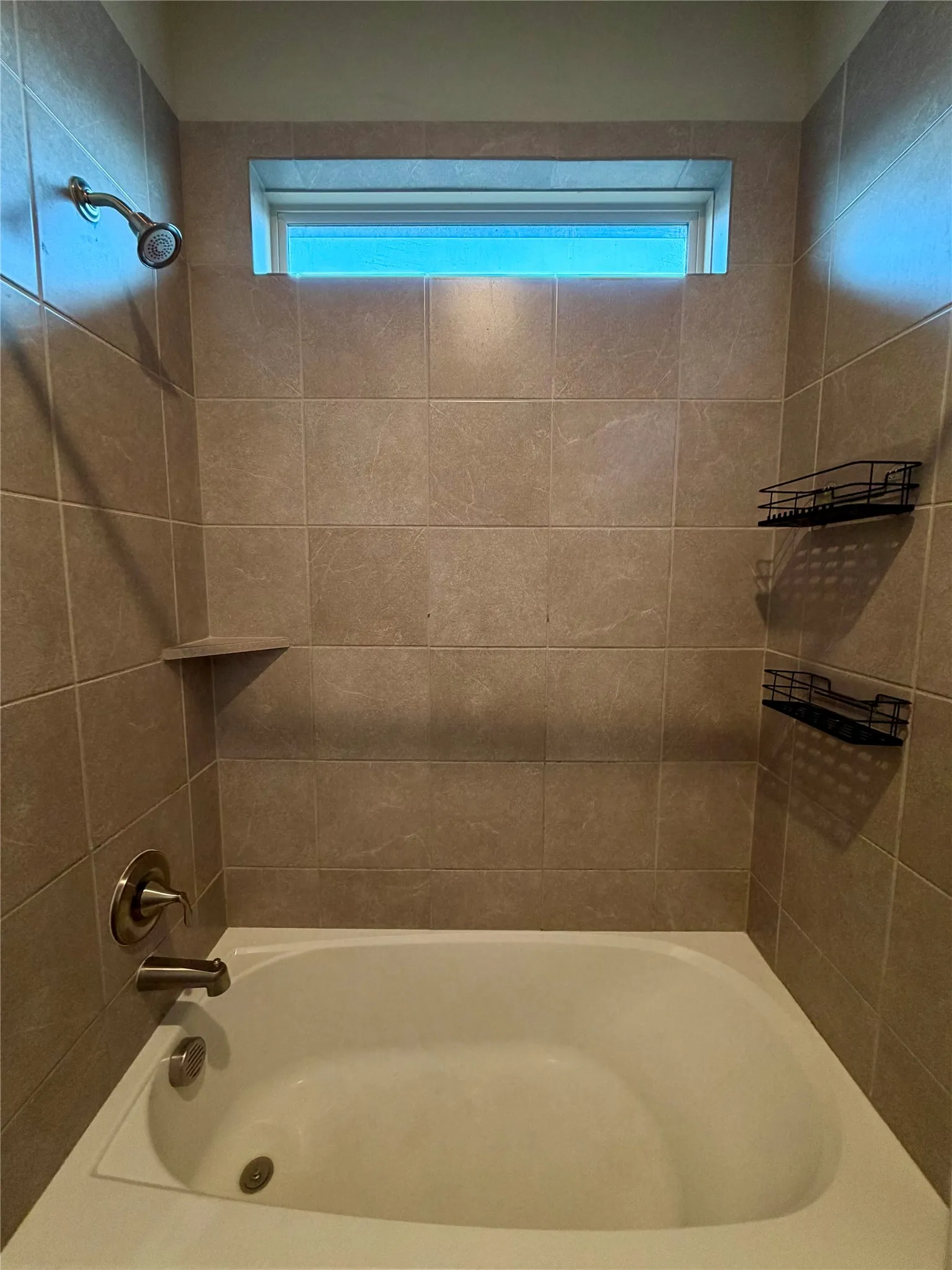 Bathroom featuring shower / washtub combination