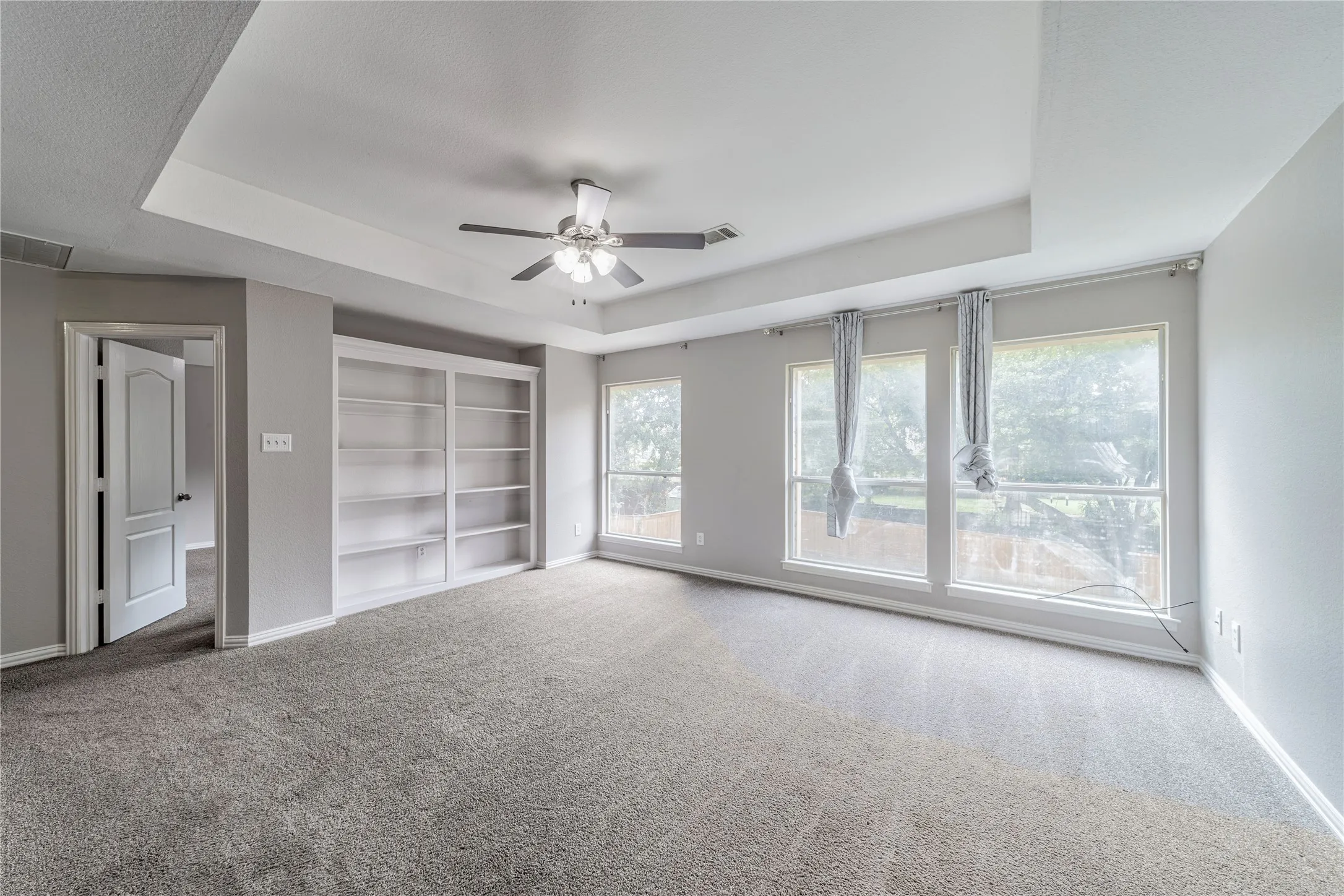 Loft are or living room #3. Cozy area with custom built-ins. Over looking the backyard.