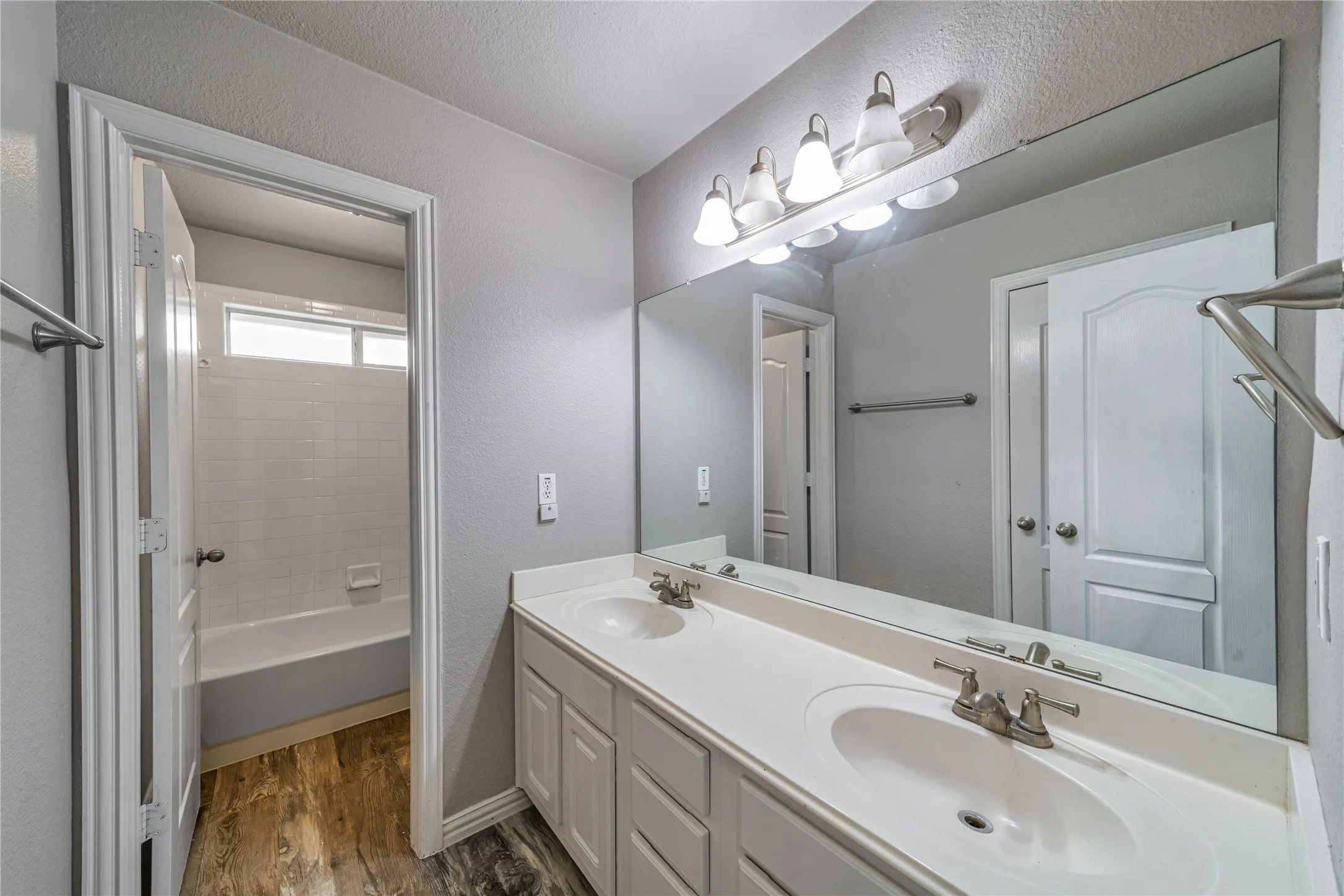 Second bathroom freshly painted with LVP installed.