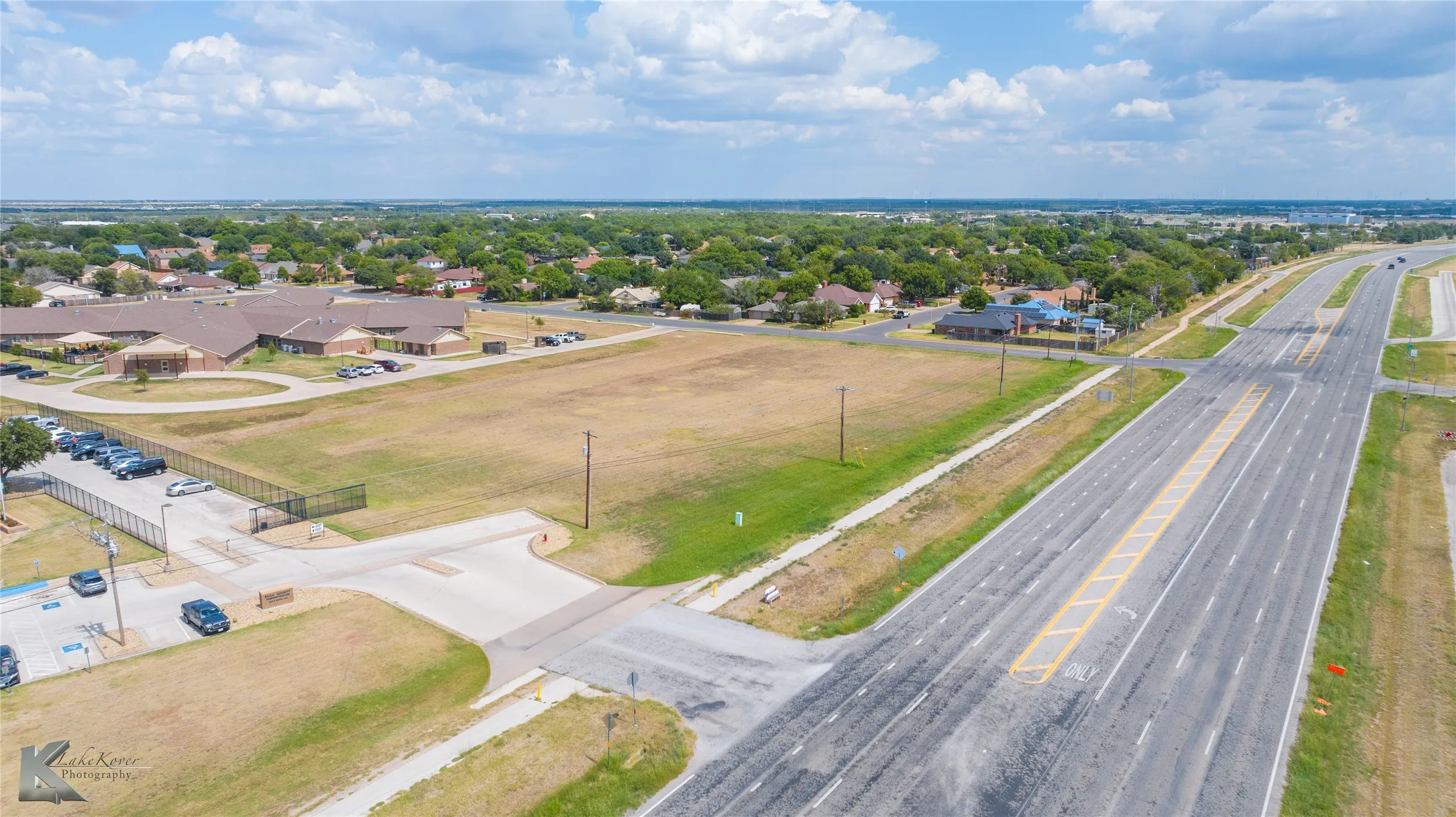 Aerial view of residential area with a major roadway