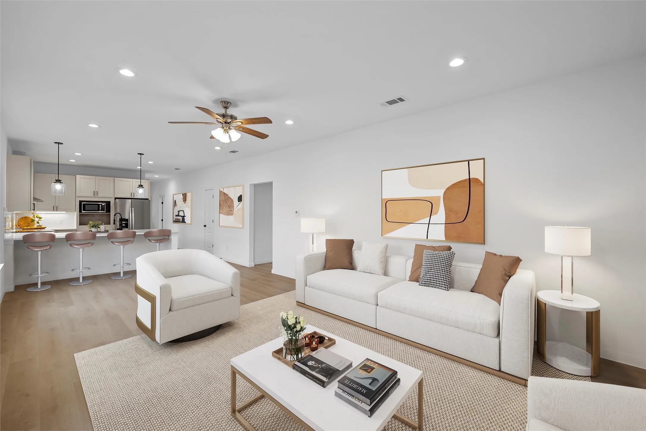 Picture virtually staged of the living room with light wood finished floors, recessed lighting, and a ceiling fan