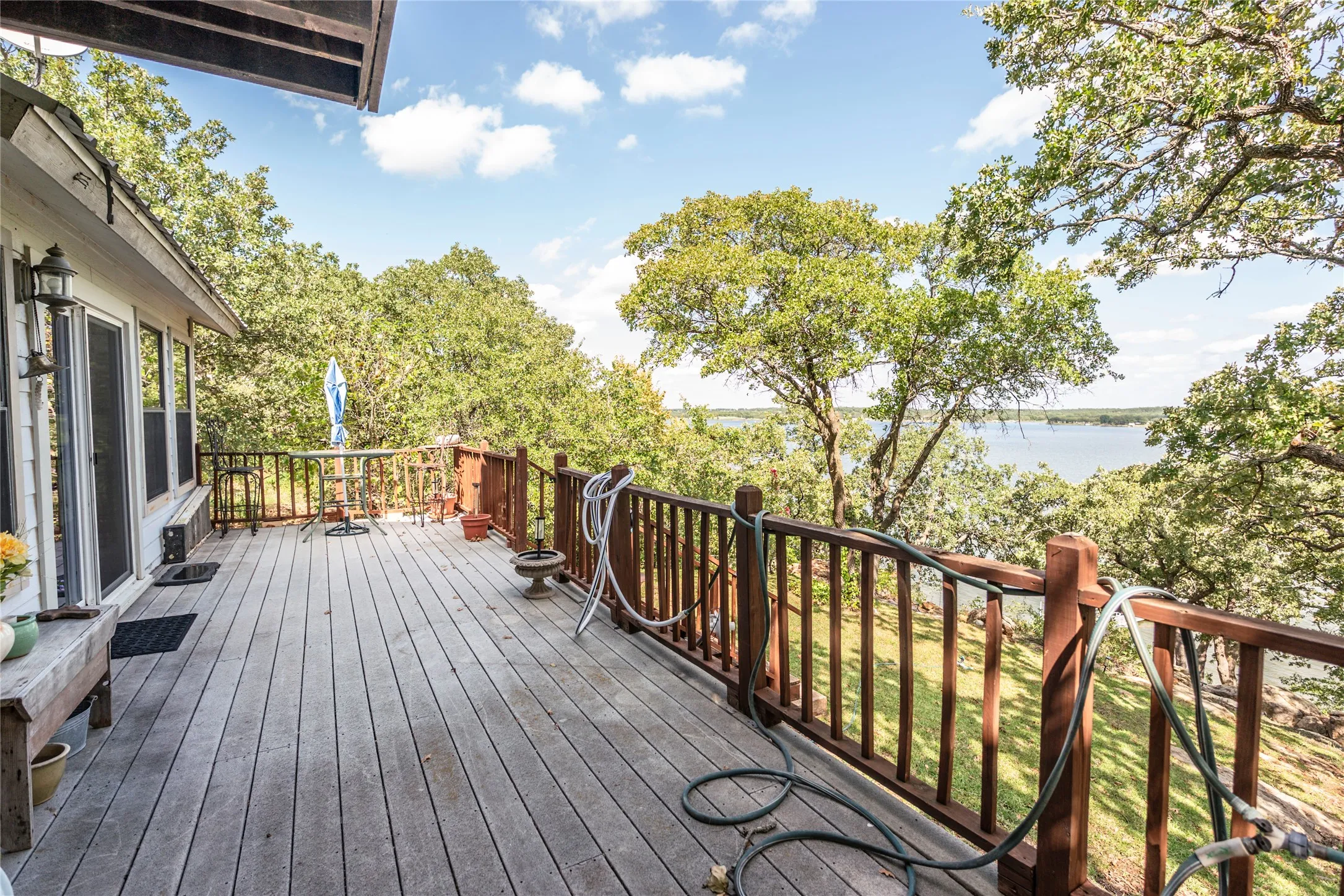 Wooden deck featuring a water view