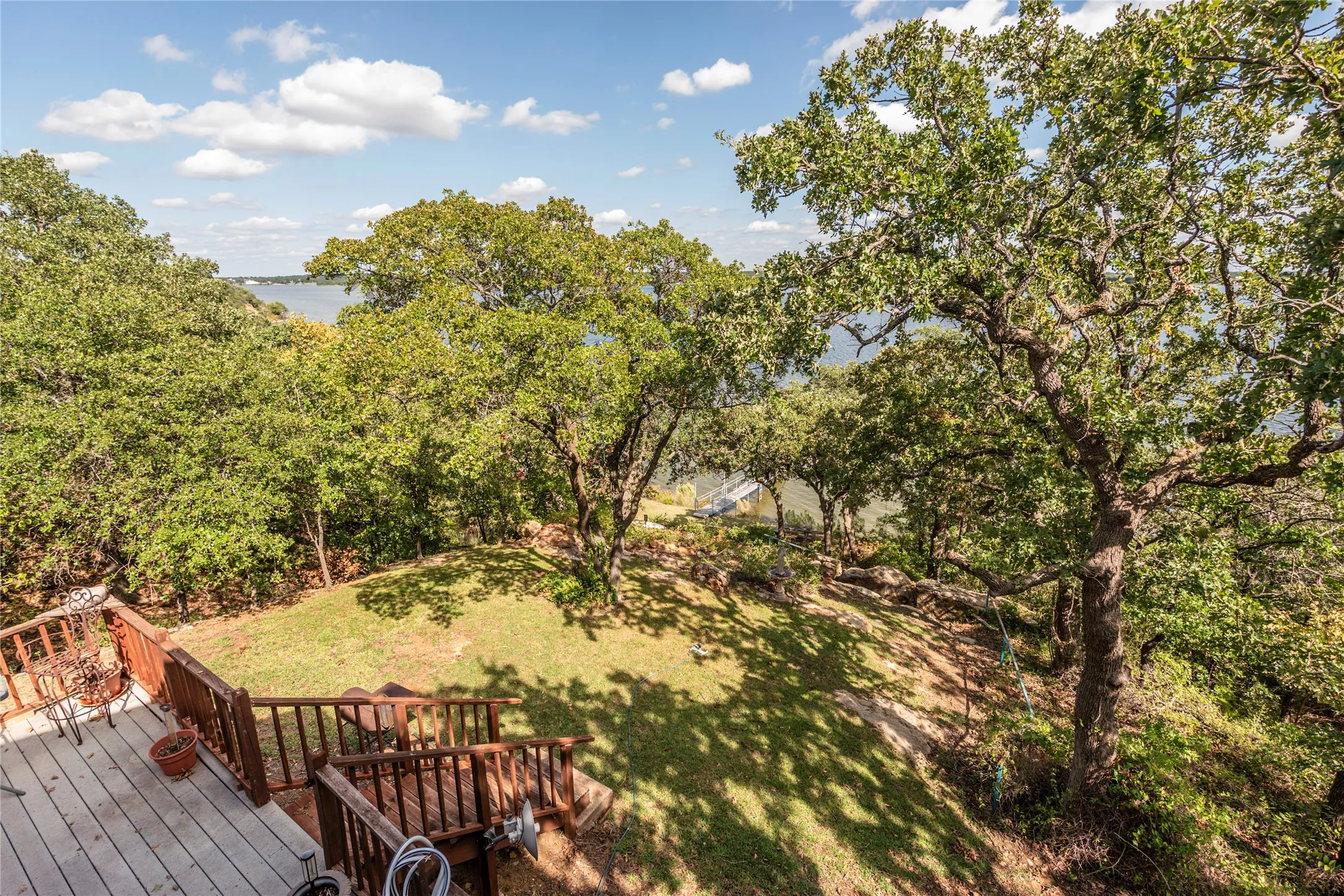Deck featuring a lawn