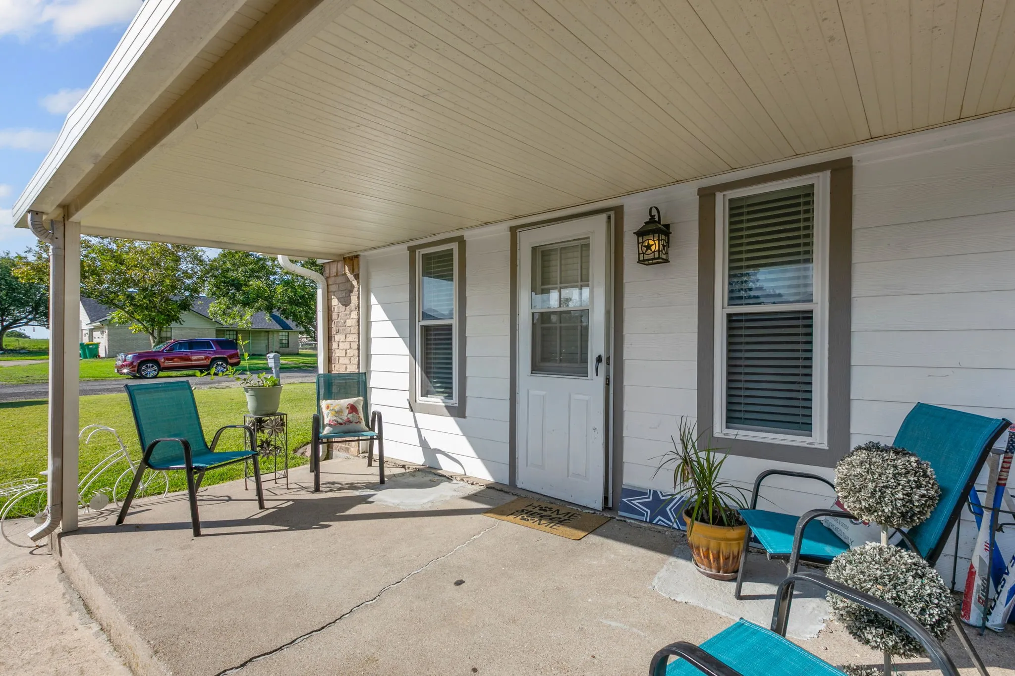 Porch featuring a yard