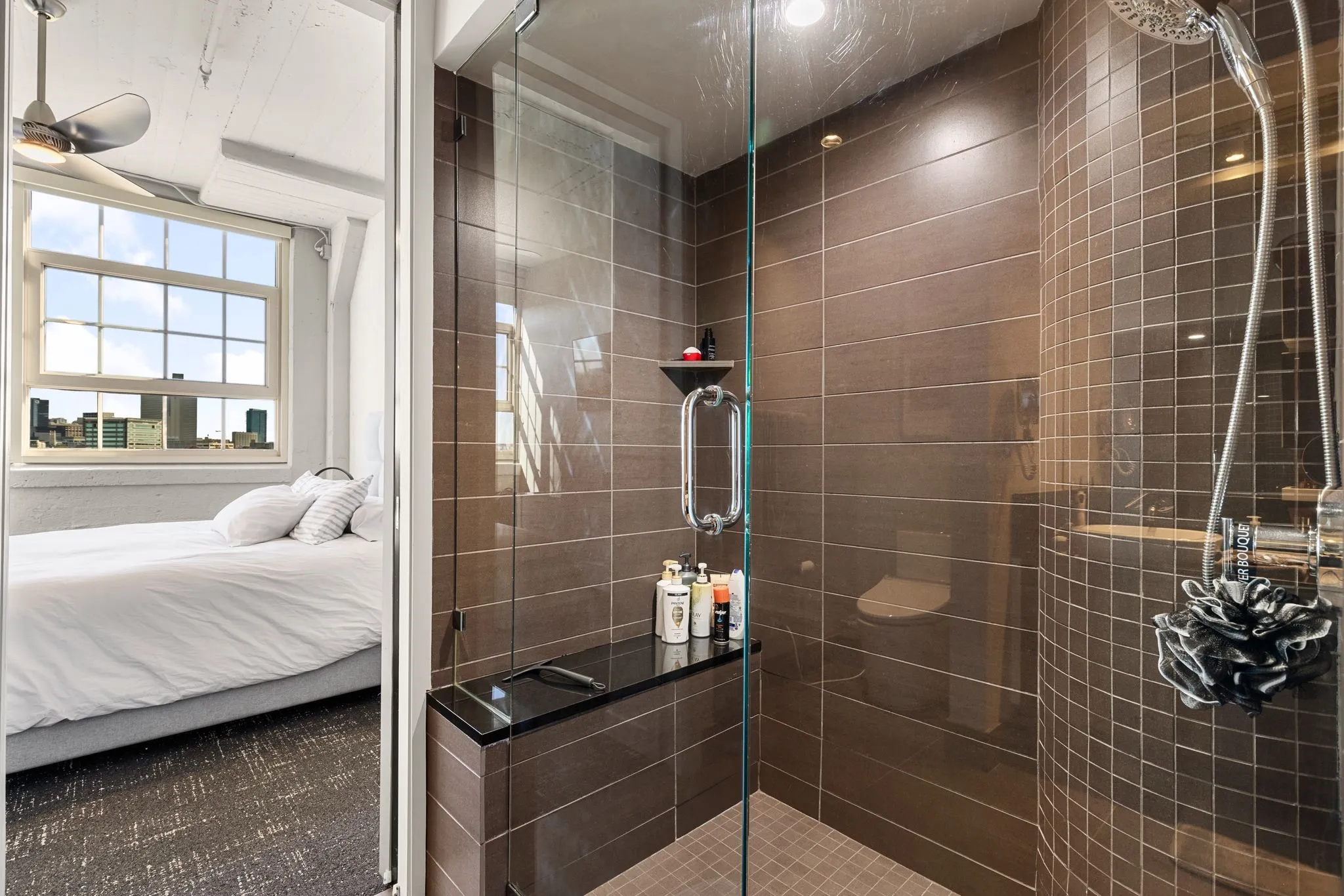 Bathroom featuring ensuite bath and a stall shower