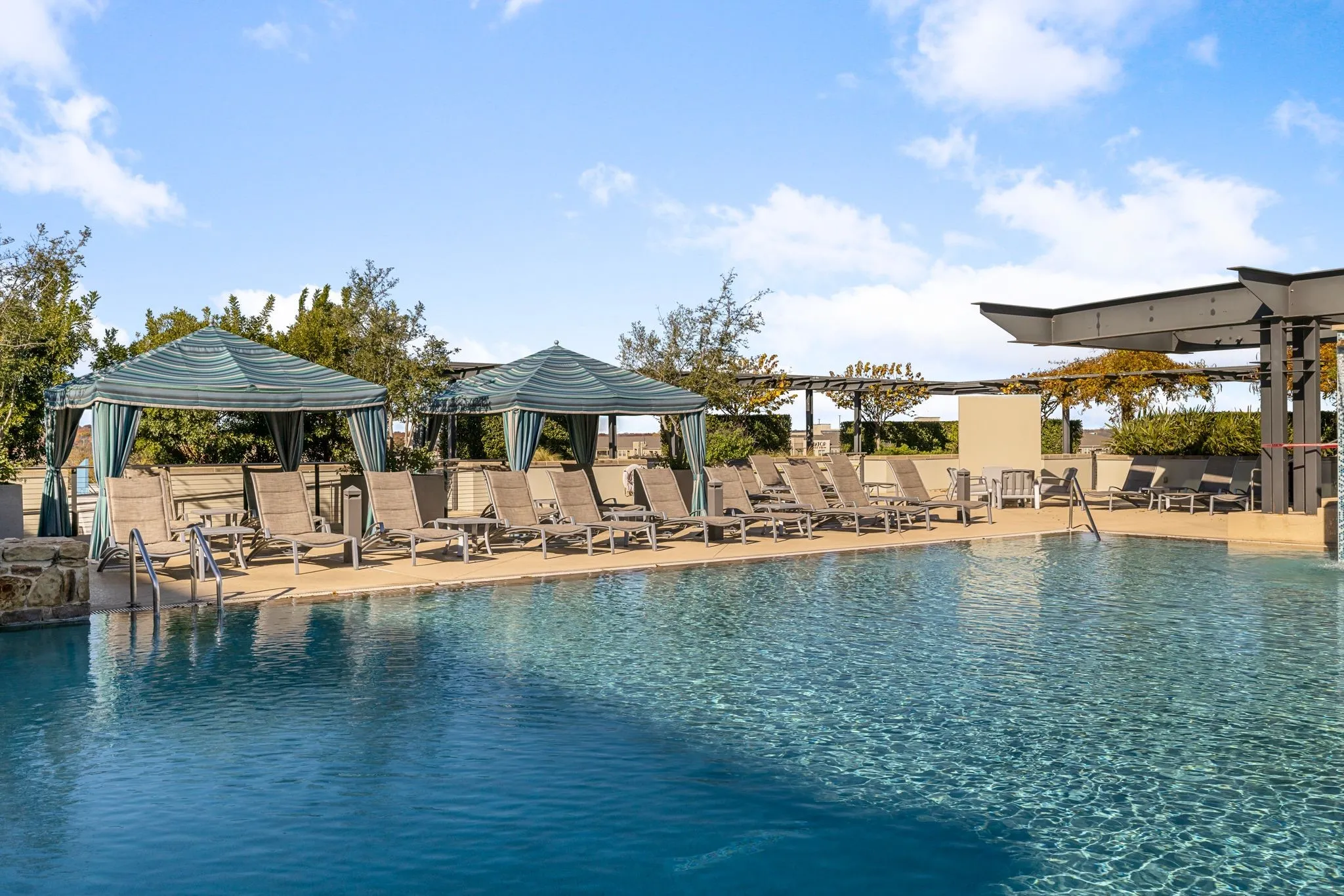 Community pool with a patio and a gazebo
